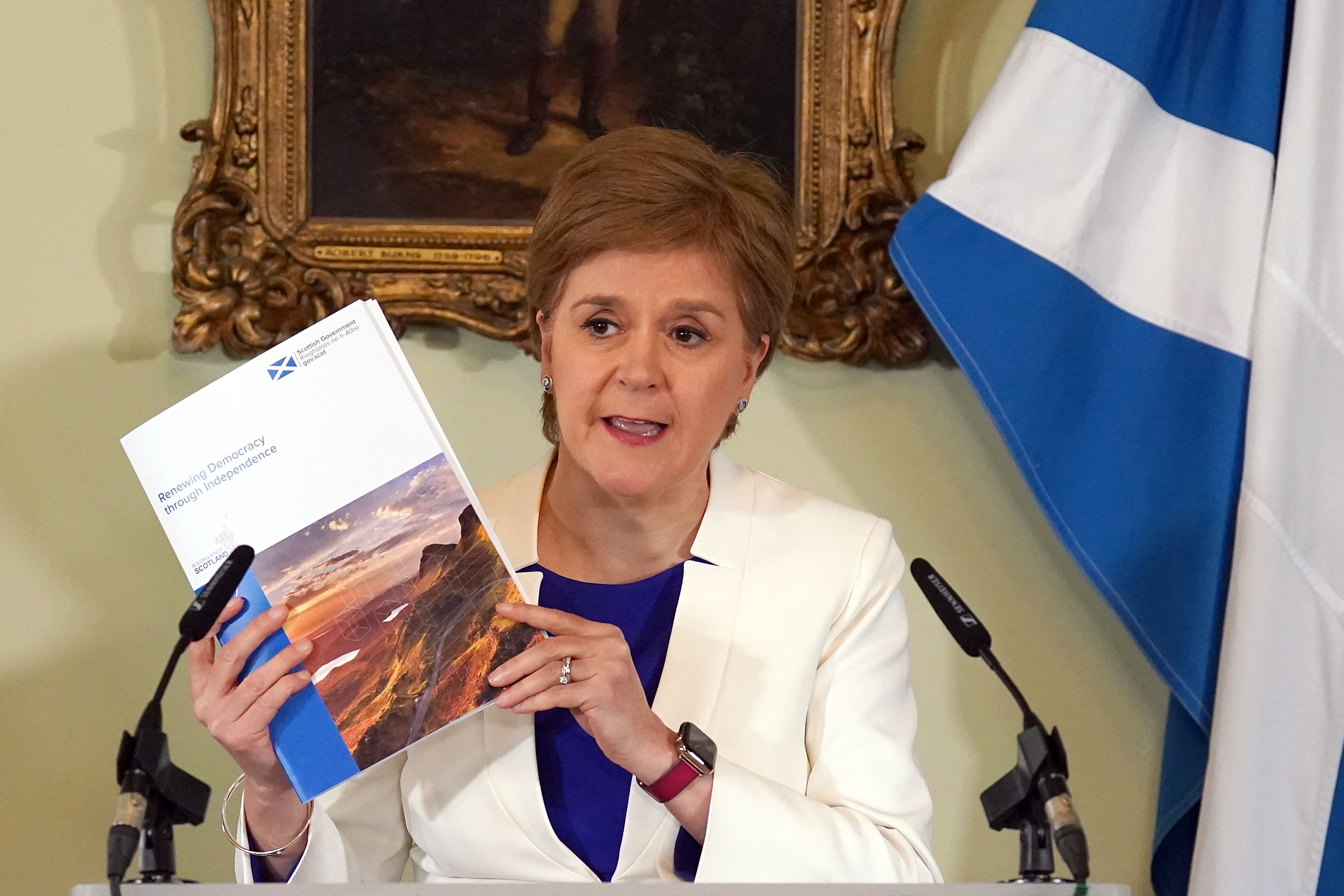 Nicola Sturgeon shows off the prospectus paper (Andrew Milligan/PA)