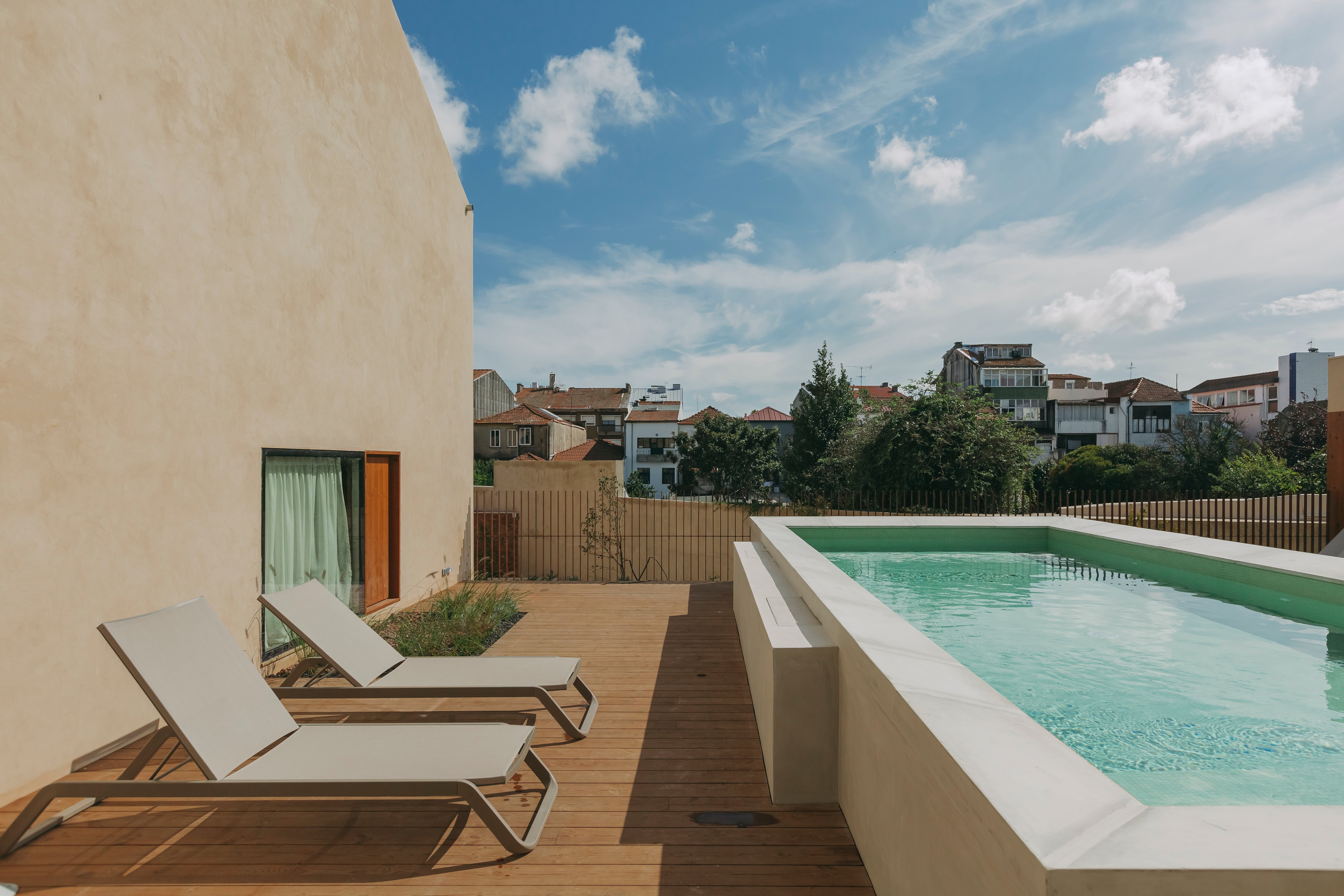 The pool can be accessed through the hotel garden