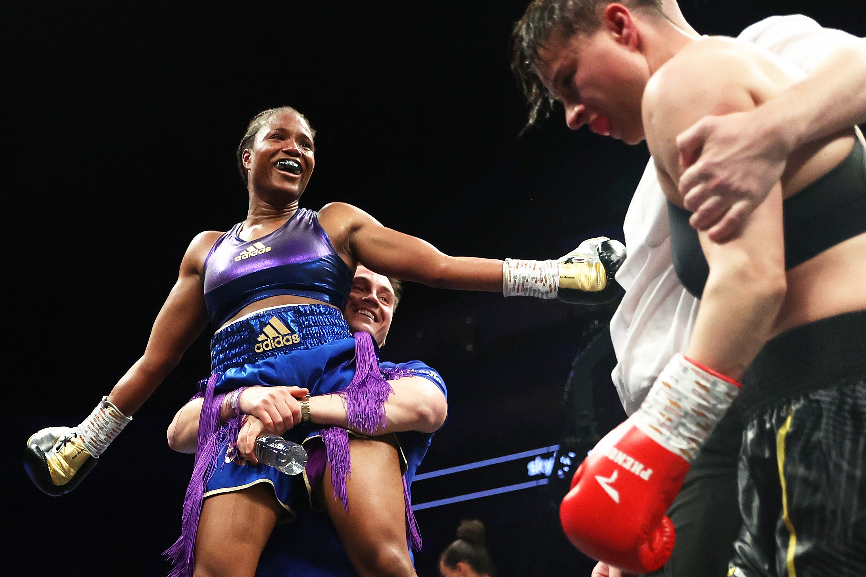 Dubois with coach Shane McGuigan after stopping Milena Koleva in October