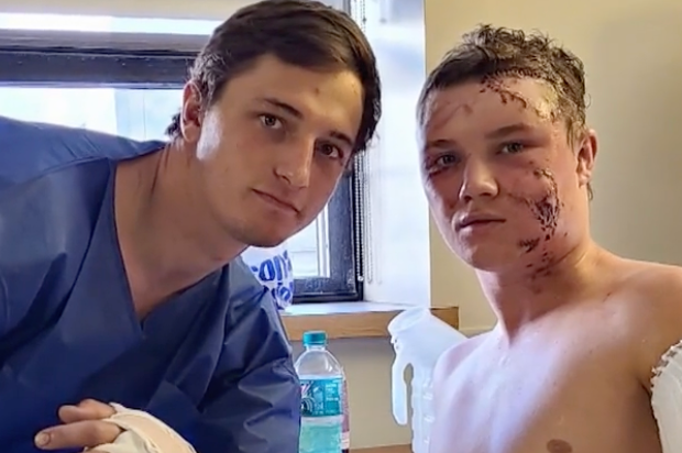 College wrestler Kendall Cummings, right, saved his friend Brady Lowry from a grizzly bear attack