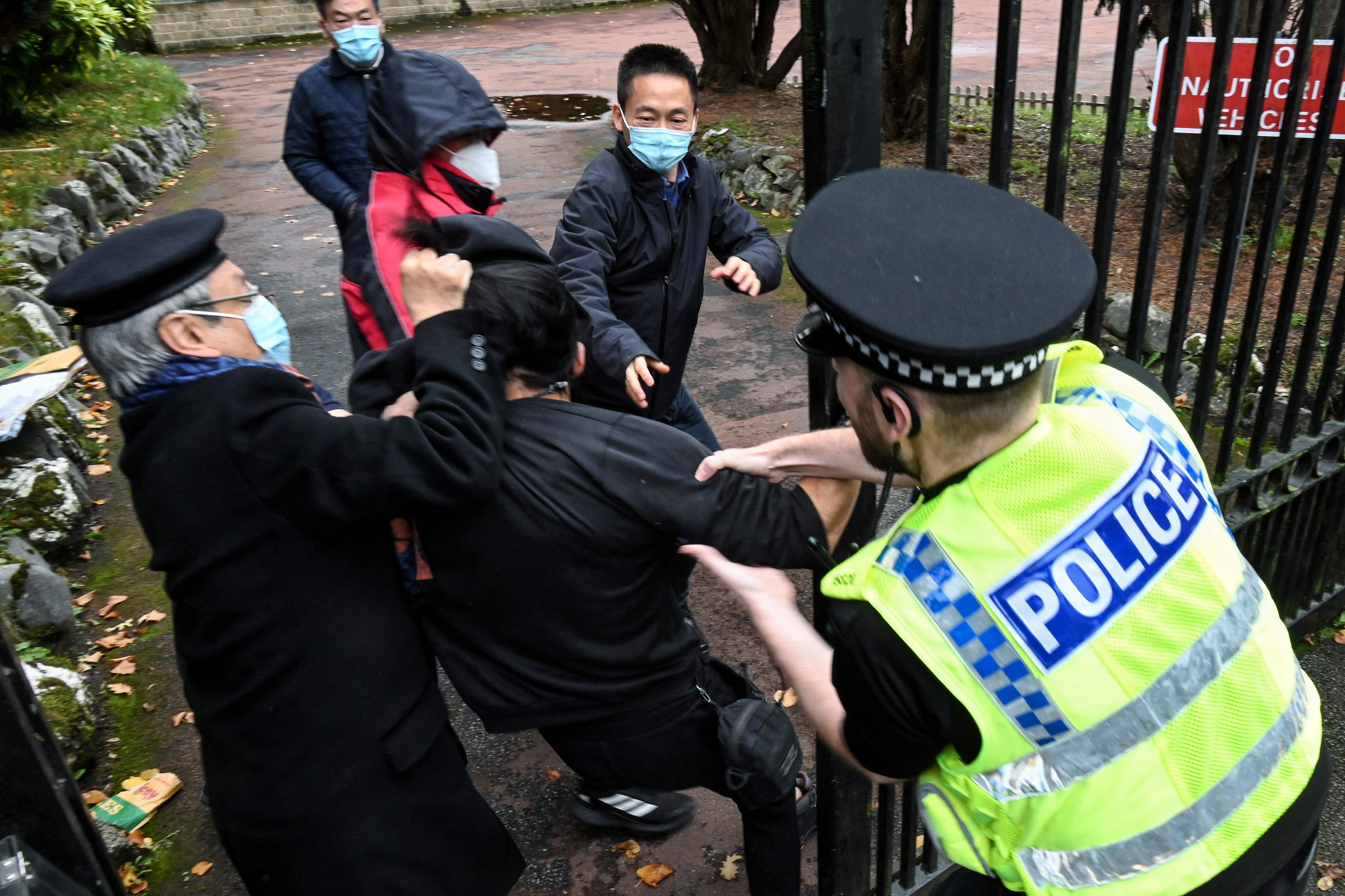 The moment a protester was attacked at the Chinese consulate