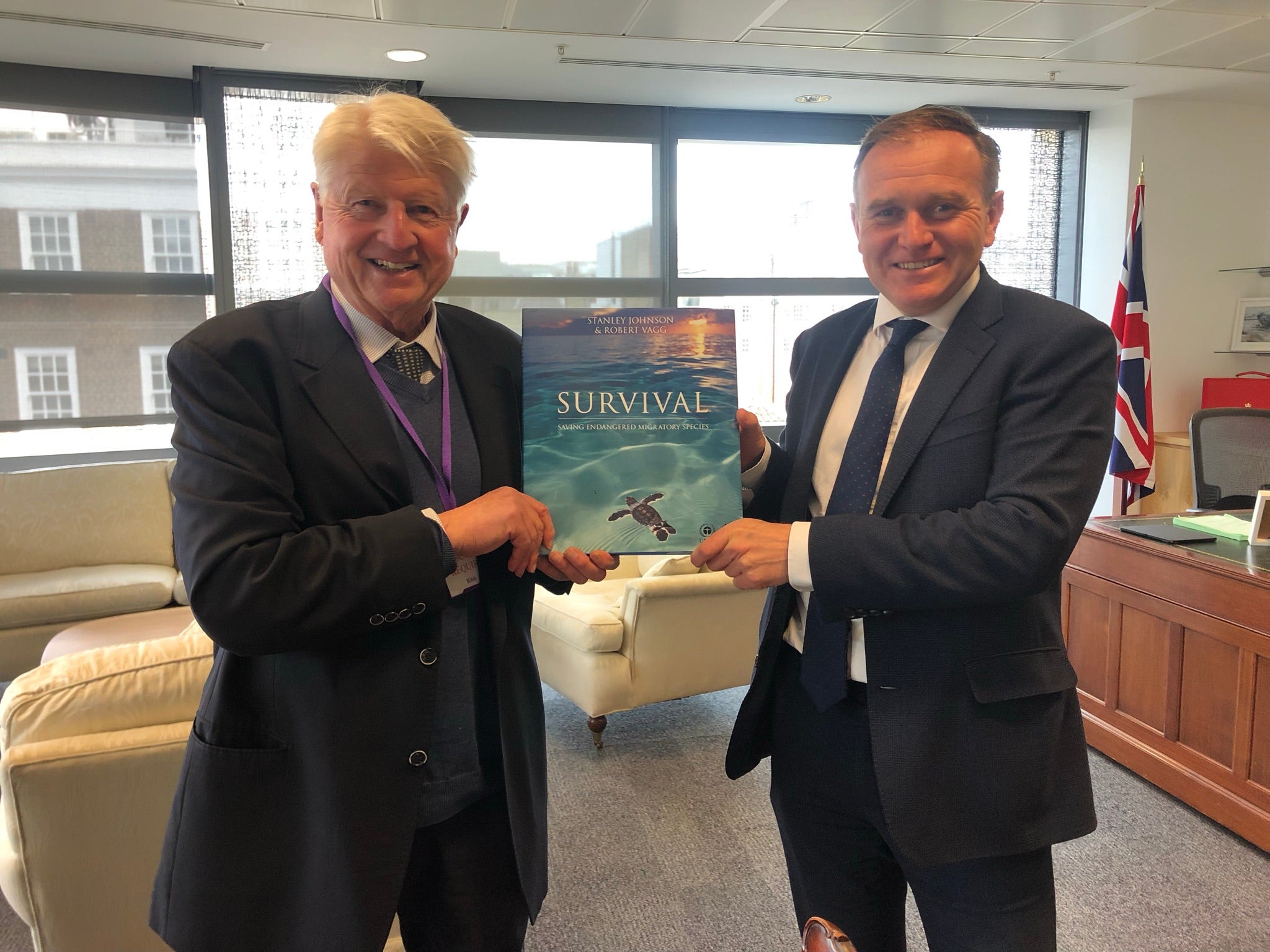 Stanley Johnson presenting his book on Endangered Species to former Defra secretary George Eustice