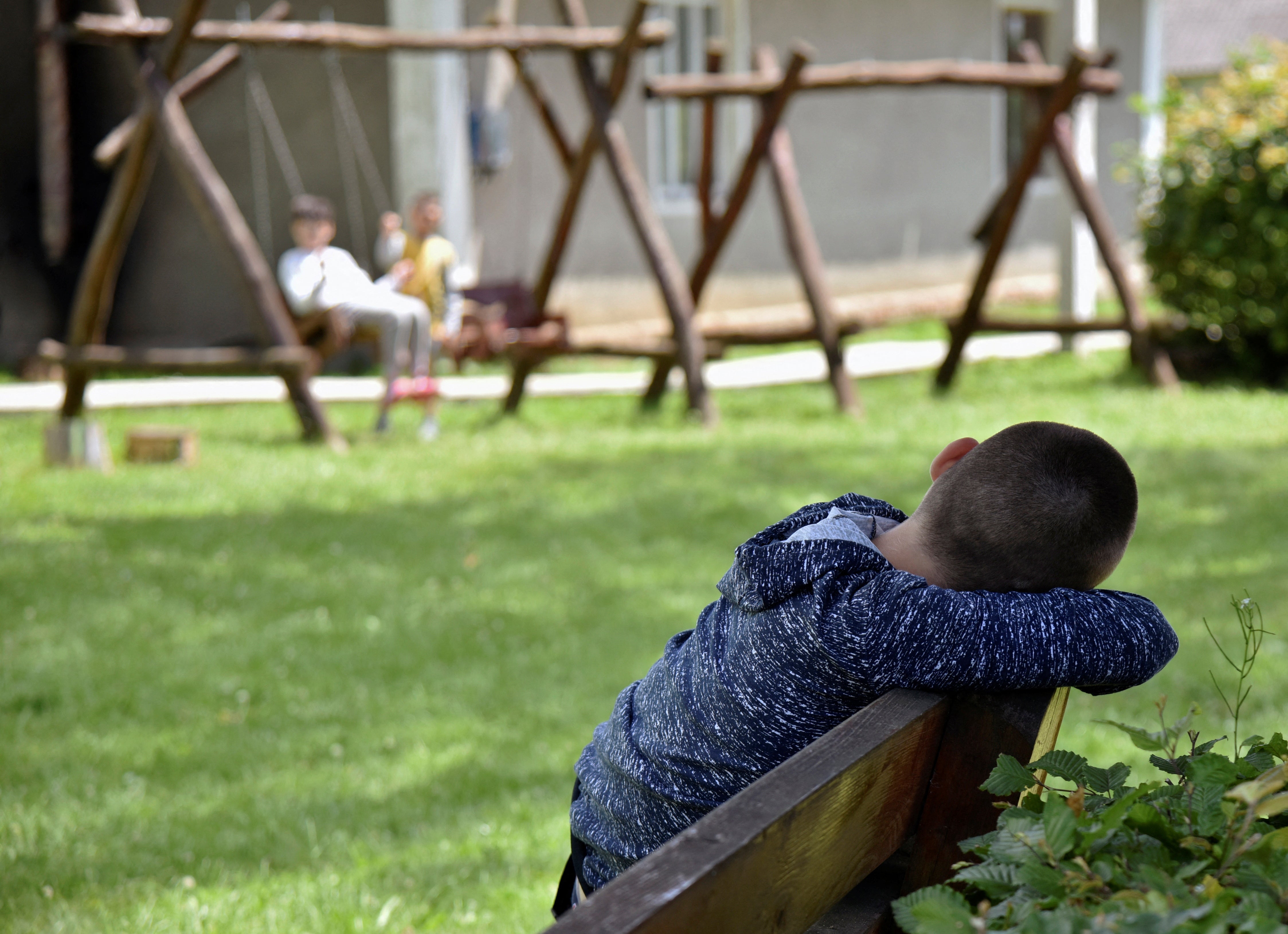 A child looks on during outdoor activities at the Lelechenya centre