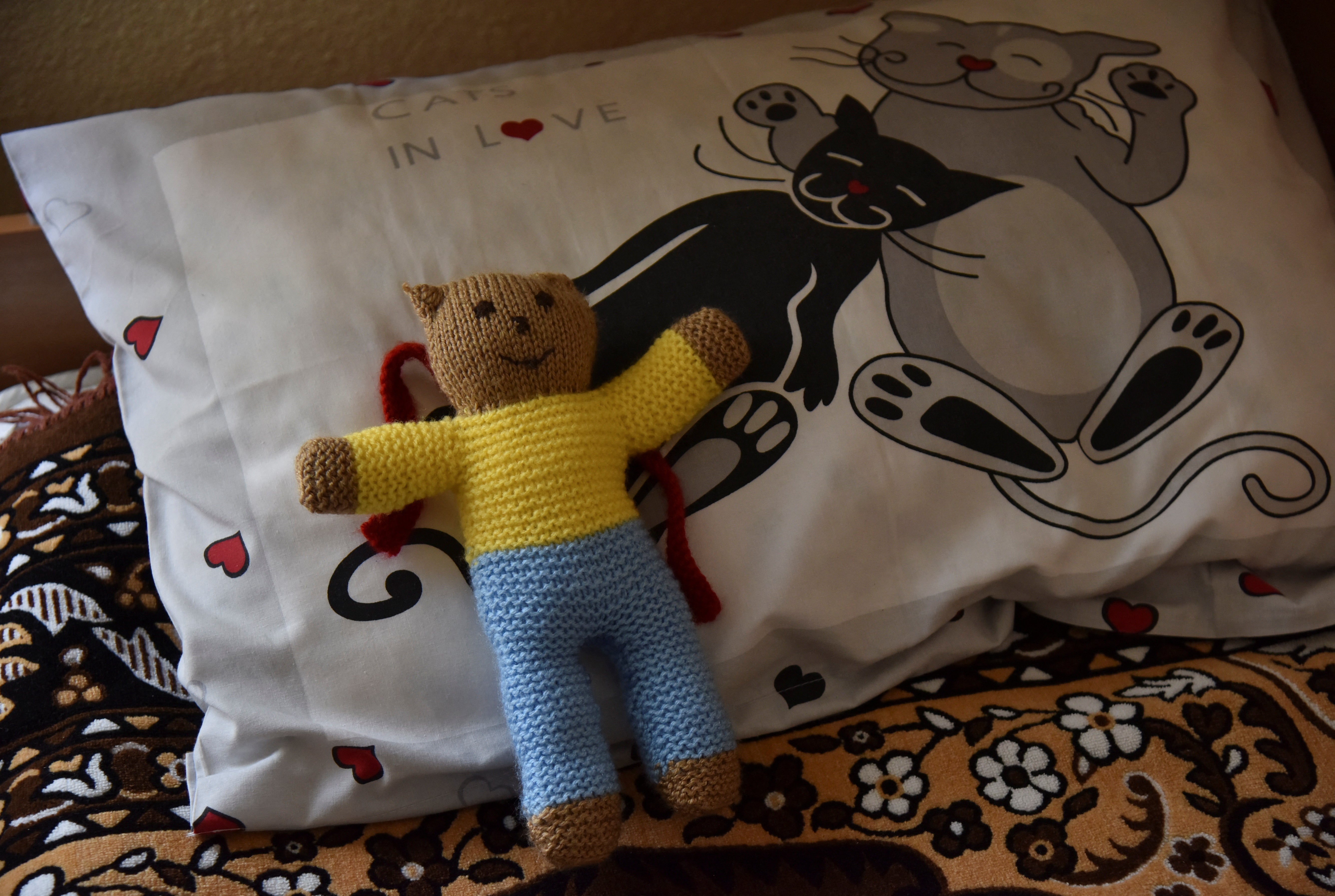 A soft toy wearing the Ukrainian flag colours is placed on a bed at Lelechenya (Little Stork) rehabilitation centre in Dzhuriv