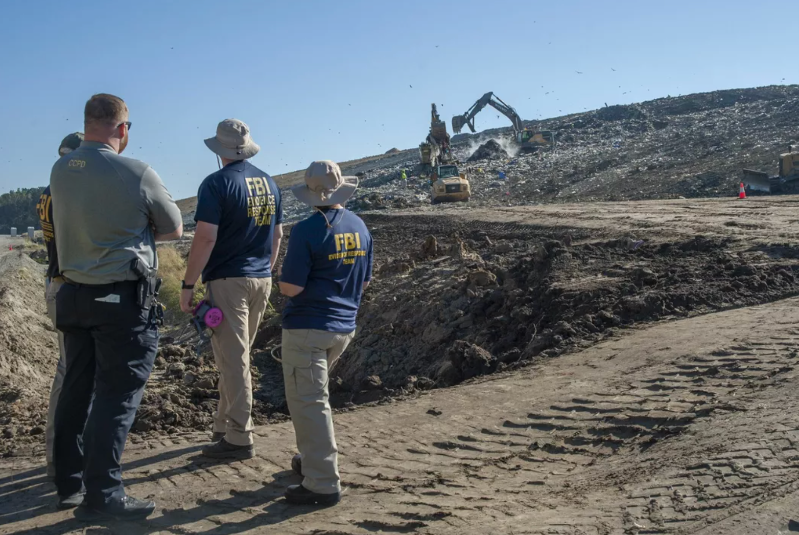 FBI agents oversee the landfill search for Quinton