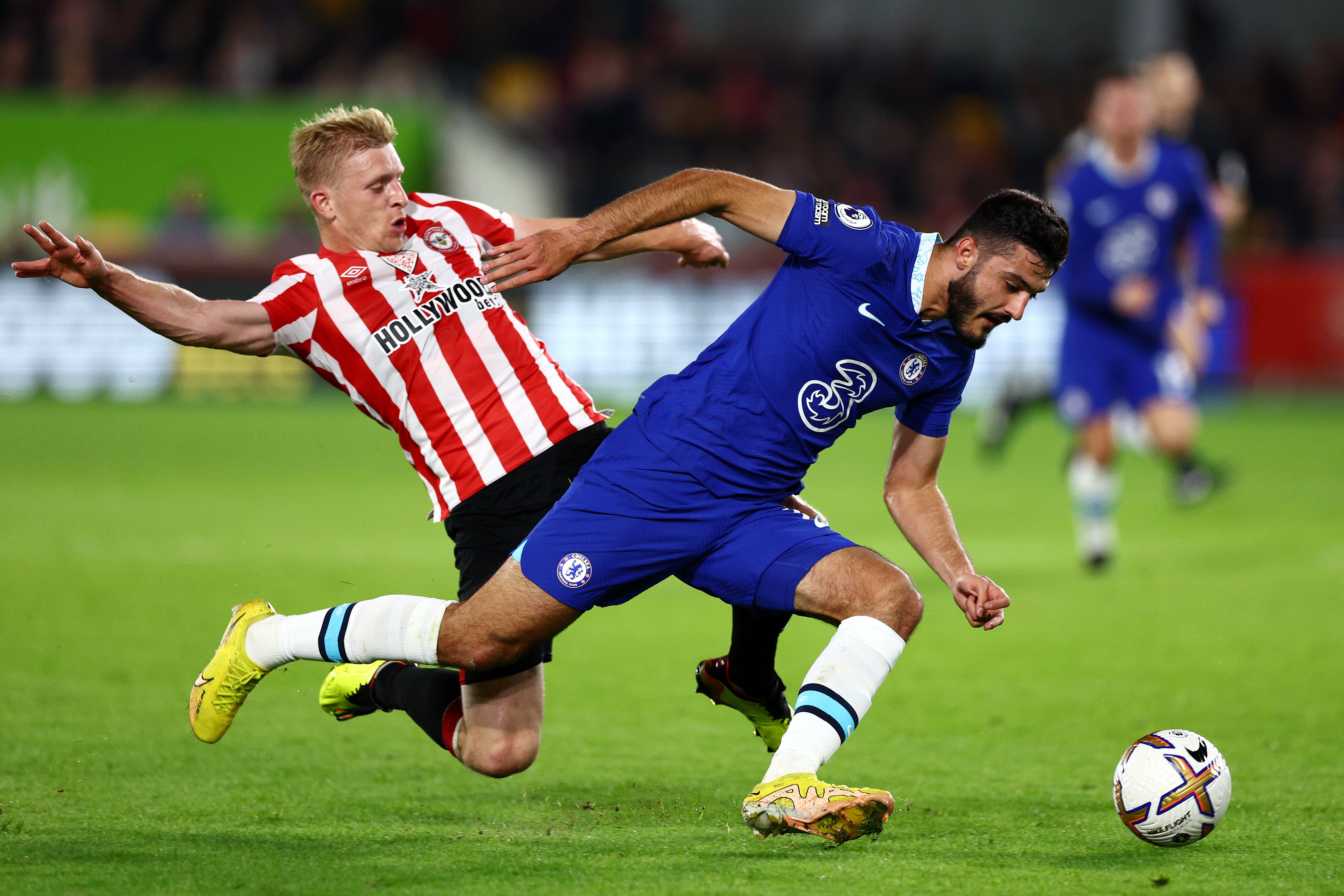 Armando Broja is challenged by Ben Mee