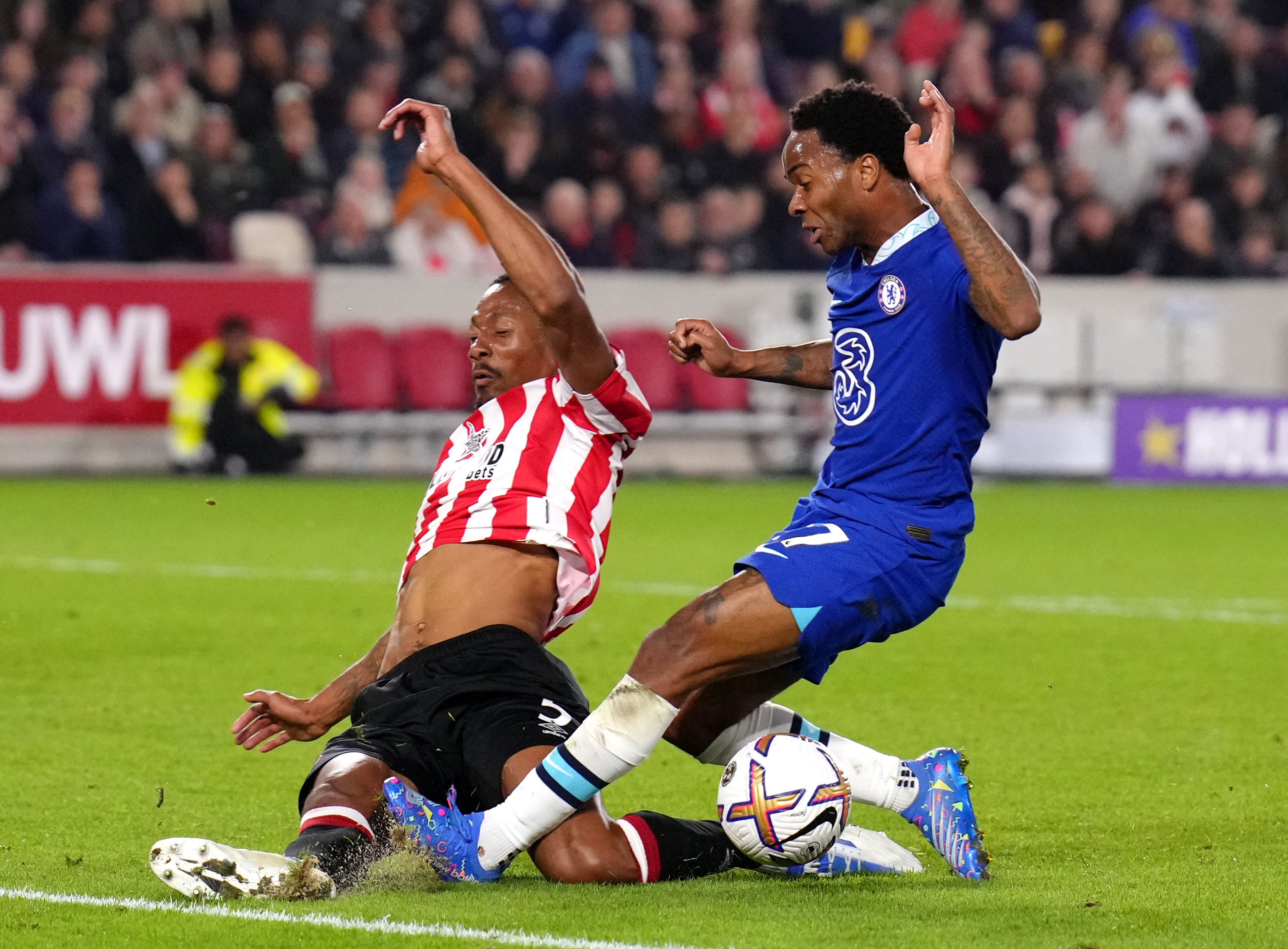 Brentford's Ethan Pinnock (left) blocks a shot from Chelsea's Raheem Sterling