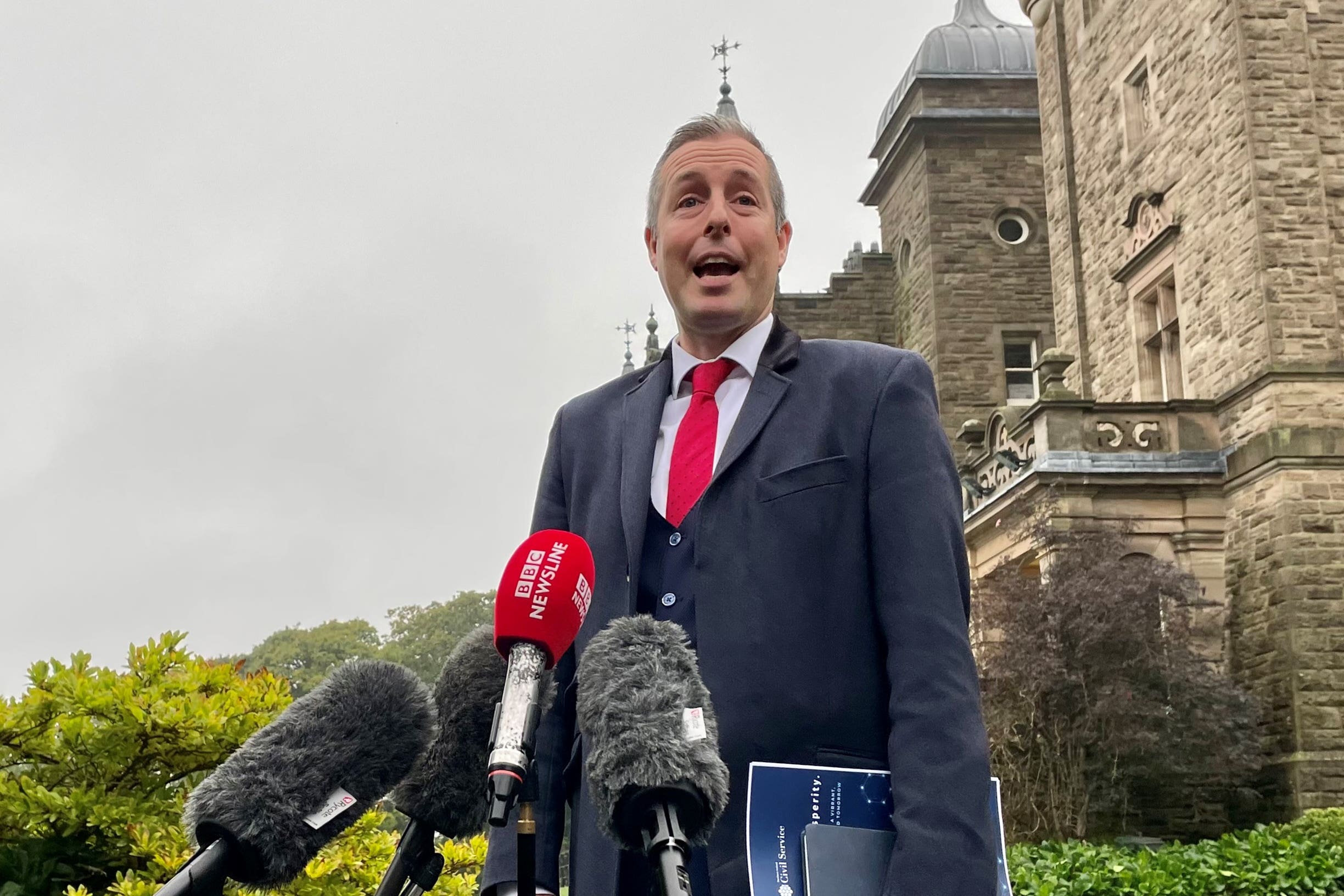 Democratic Unionist Party (DUP) Assembly member Paul Givan speaking outside Stormont Castle (PA)