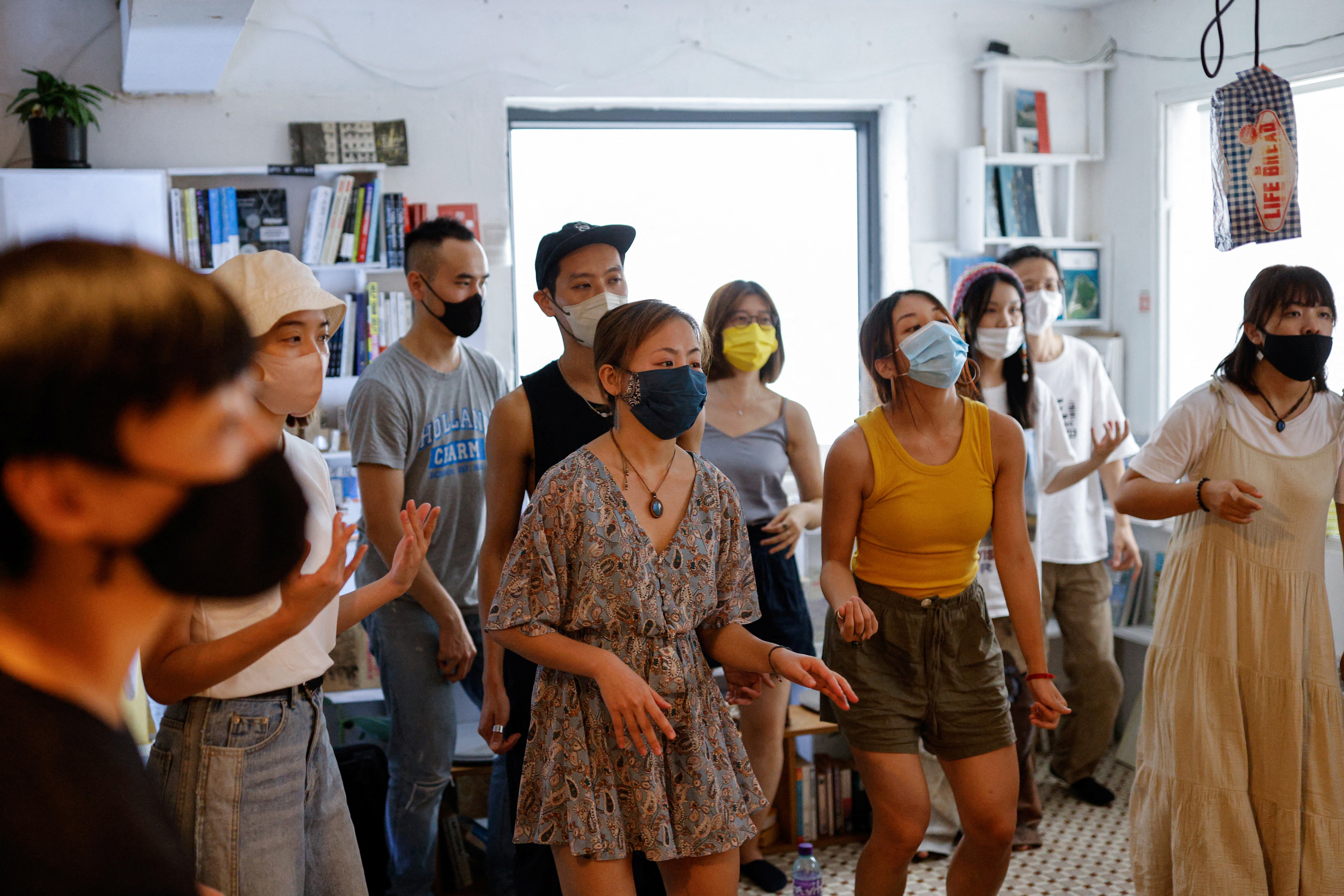 People enjoy a reggae event at a bookstore