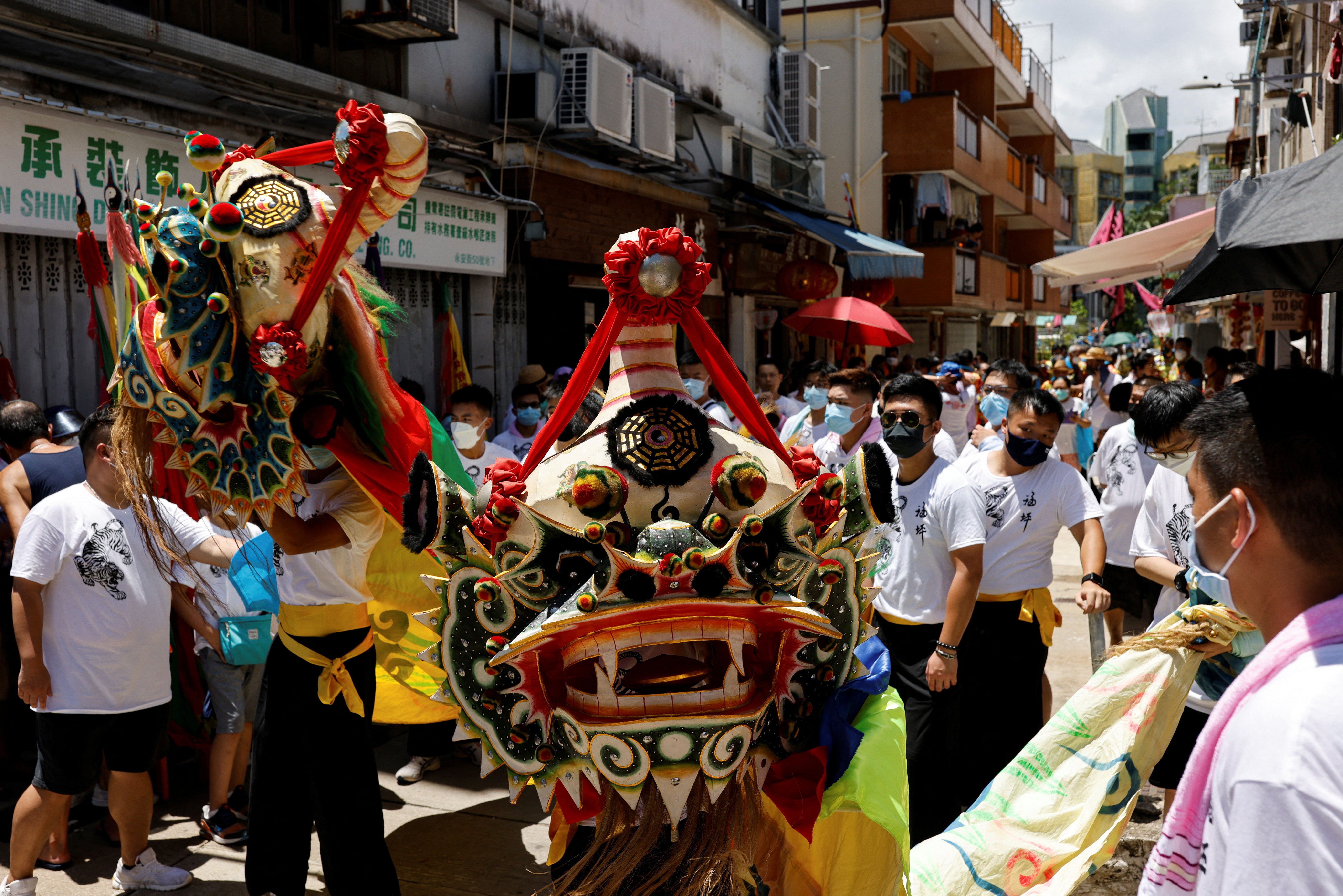 People join in the Tin Hau parade, the biggest festival on Peng Chau island which celebrates the birth of the sea goddess