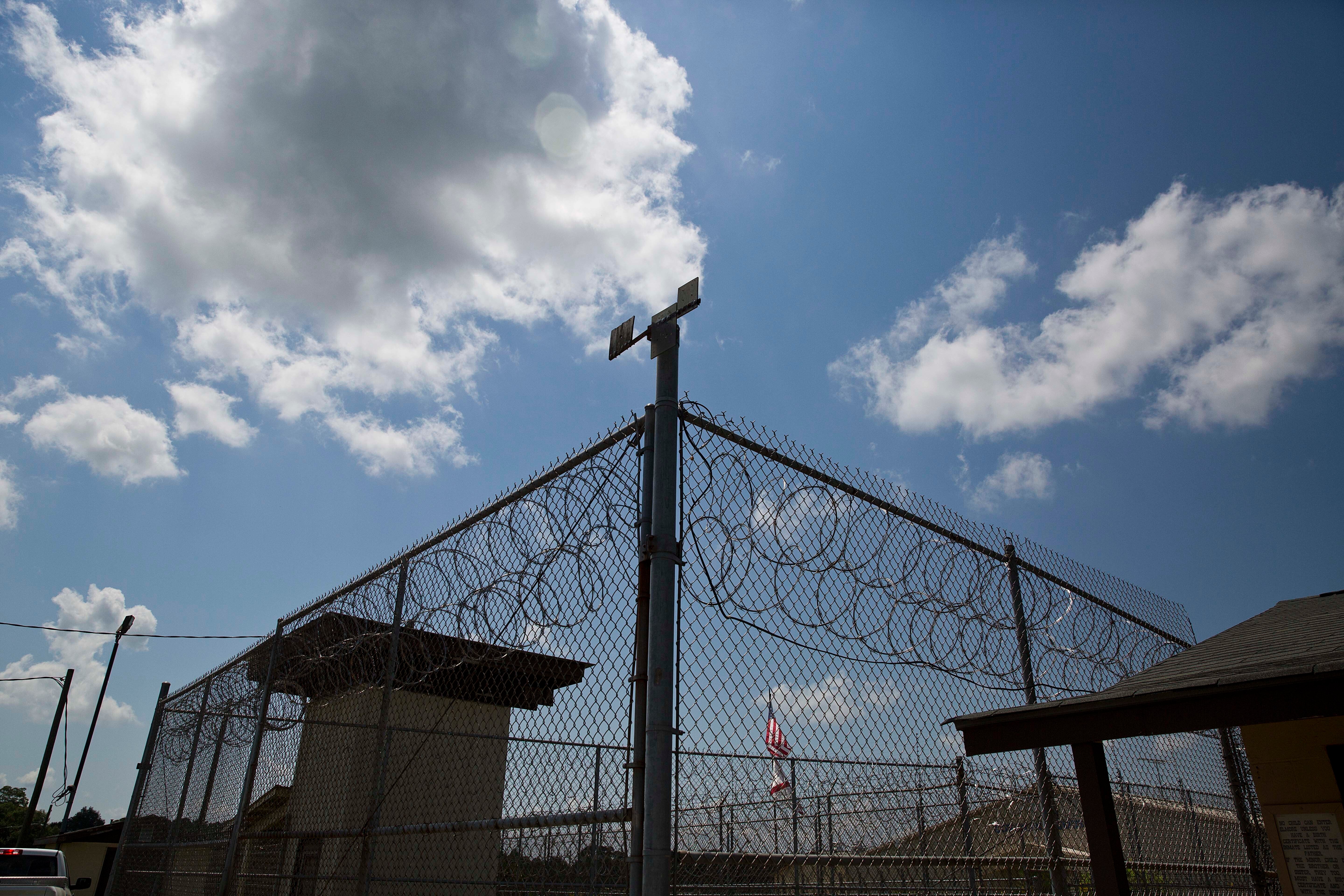 A fence is pictured outside Elmore Correctional Facility in Alabama. Incarcerated people in the state alleged forced starvation and labour during a recent three-week strike.