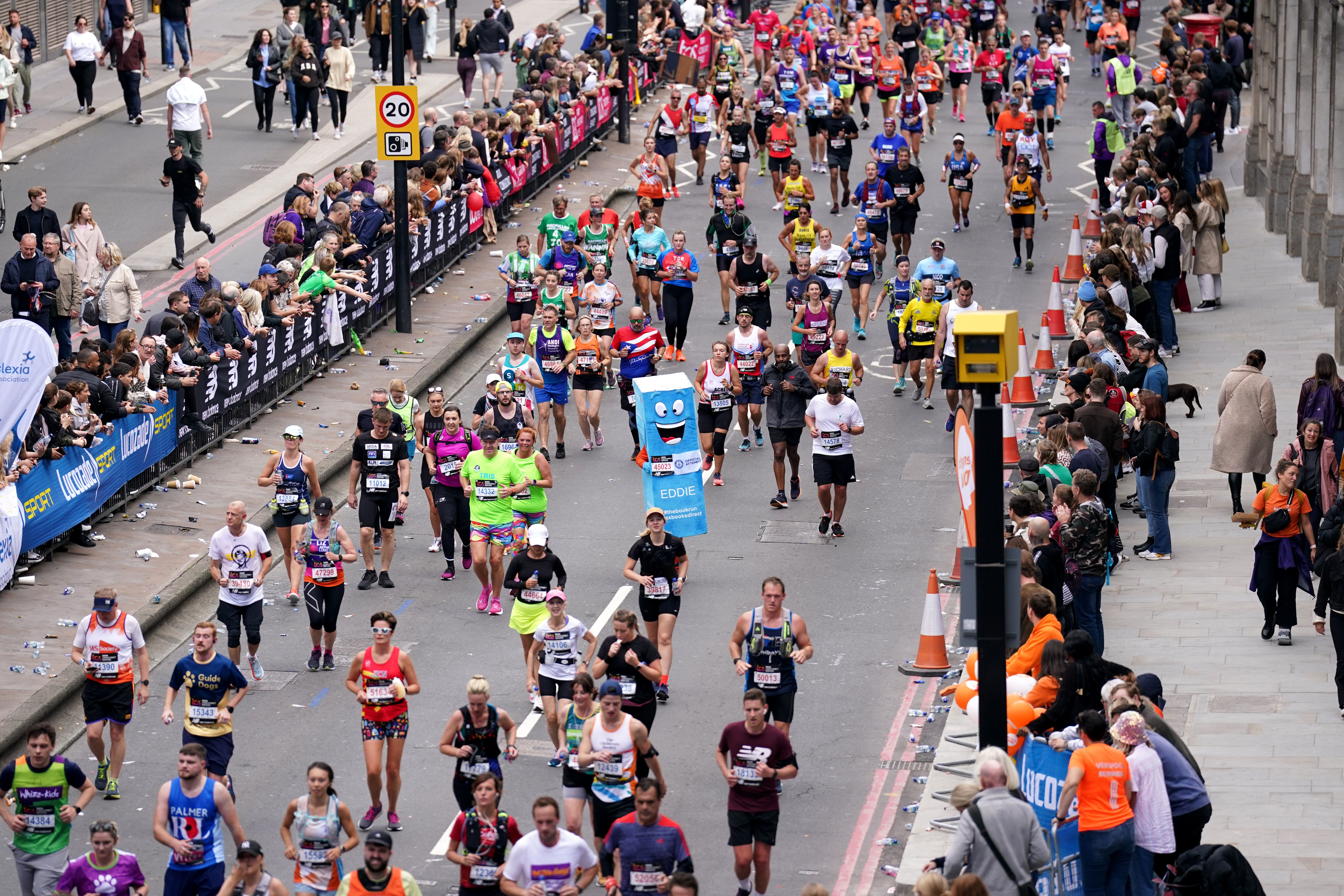 Runners in fancy dress during the TCS London Marathon 2022 (Kirsty O’Connor/PA)