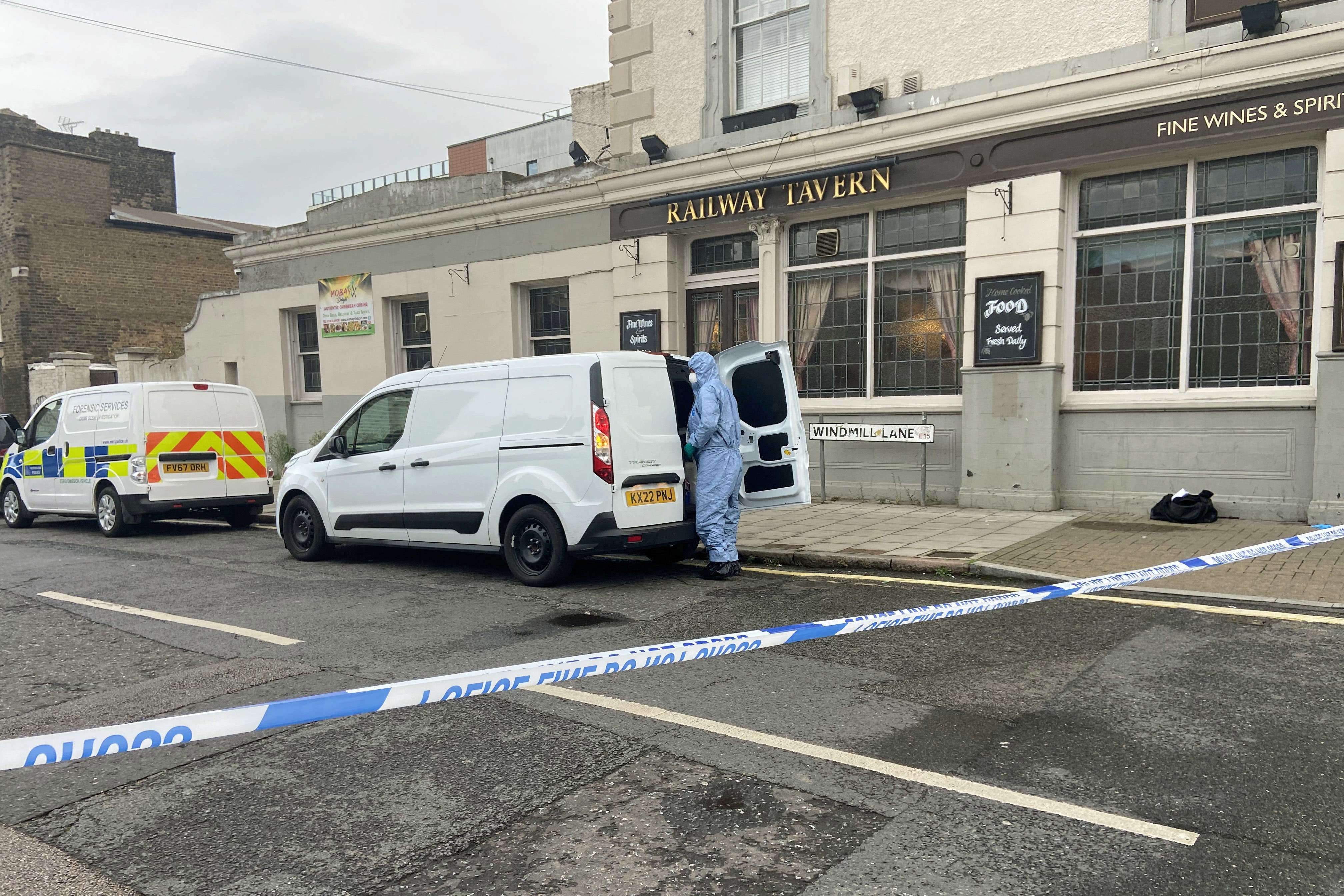 A forensics officer at the scene in Newham, east London (Gina Kalsi/PA)