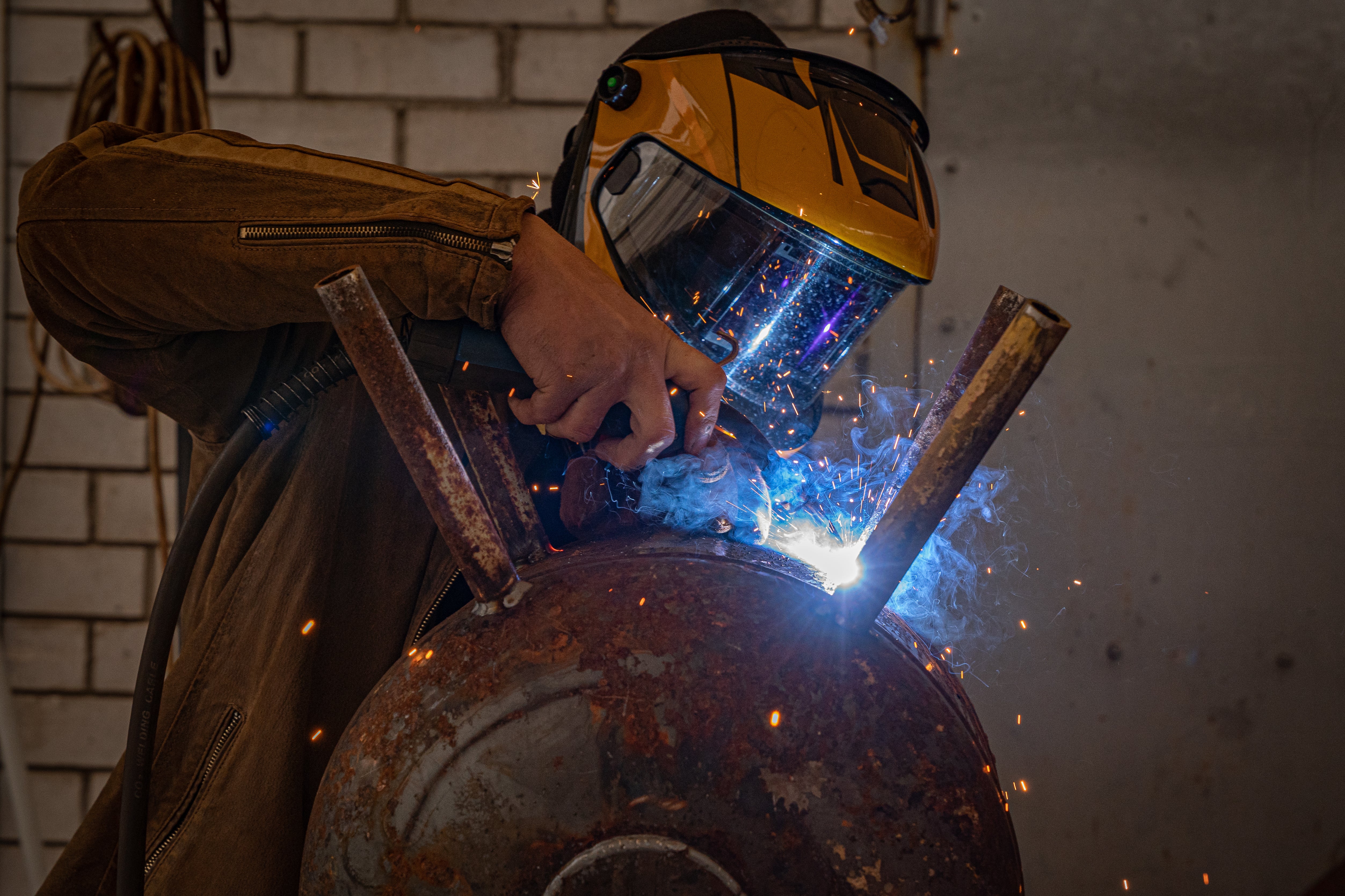 Mechanics in Kyiv are welding makeshift stoves ahead of a bitter winter without power