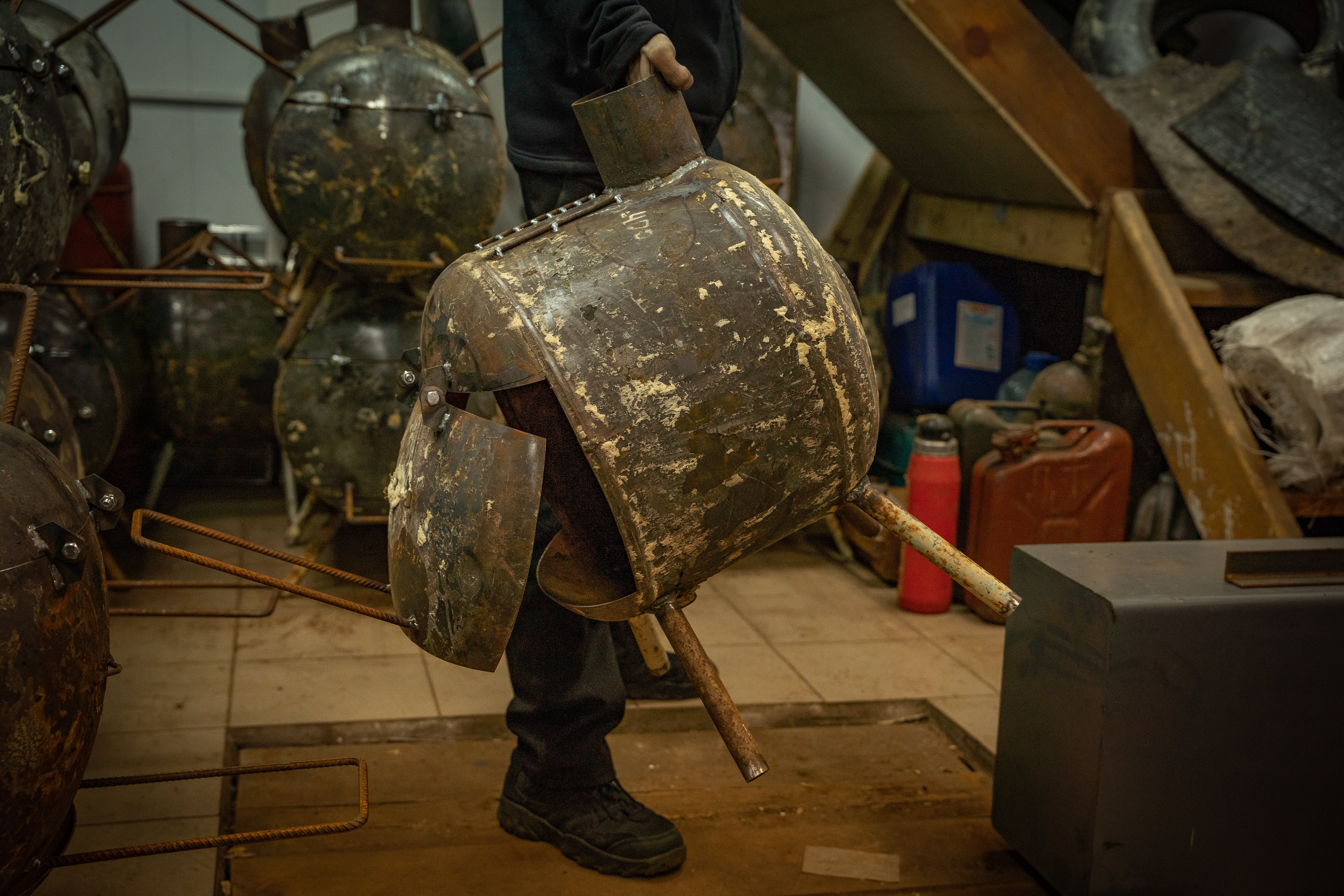 Made of a discarded water heater and scrap metal, this pot belly stove is designed to help Ukrainians this winter