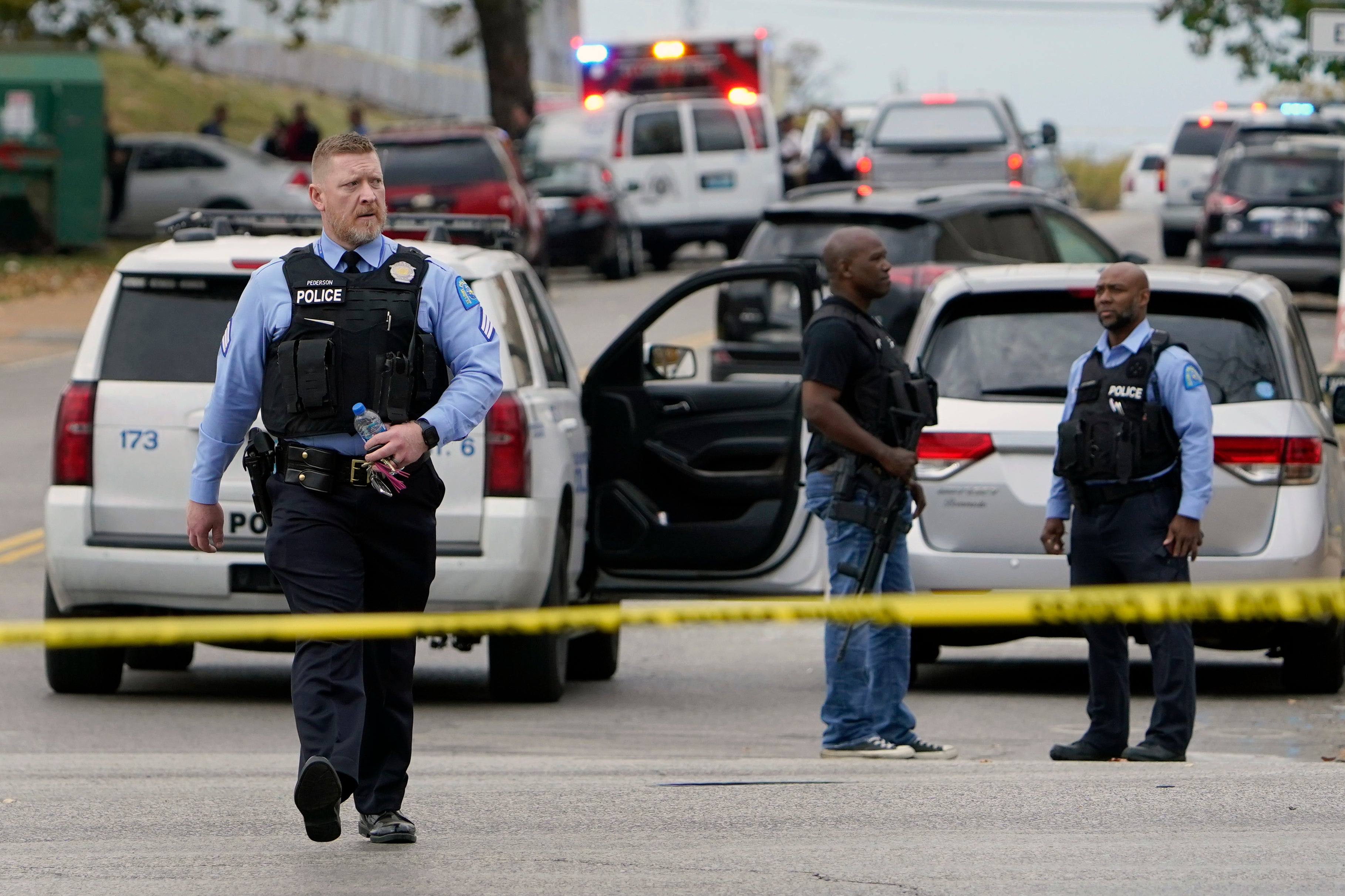 Law enforcement investigate the scene of a shooting at Central Visual and Performing Arts High School Monday