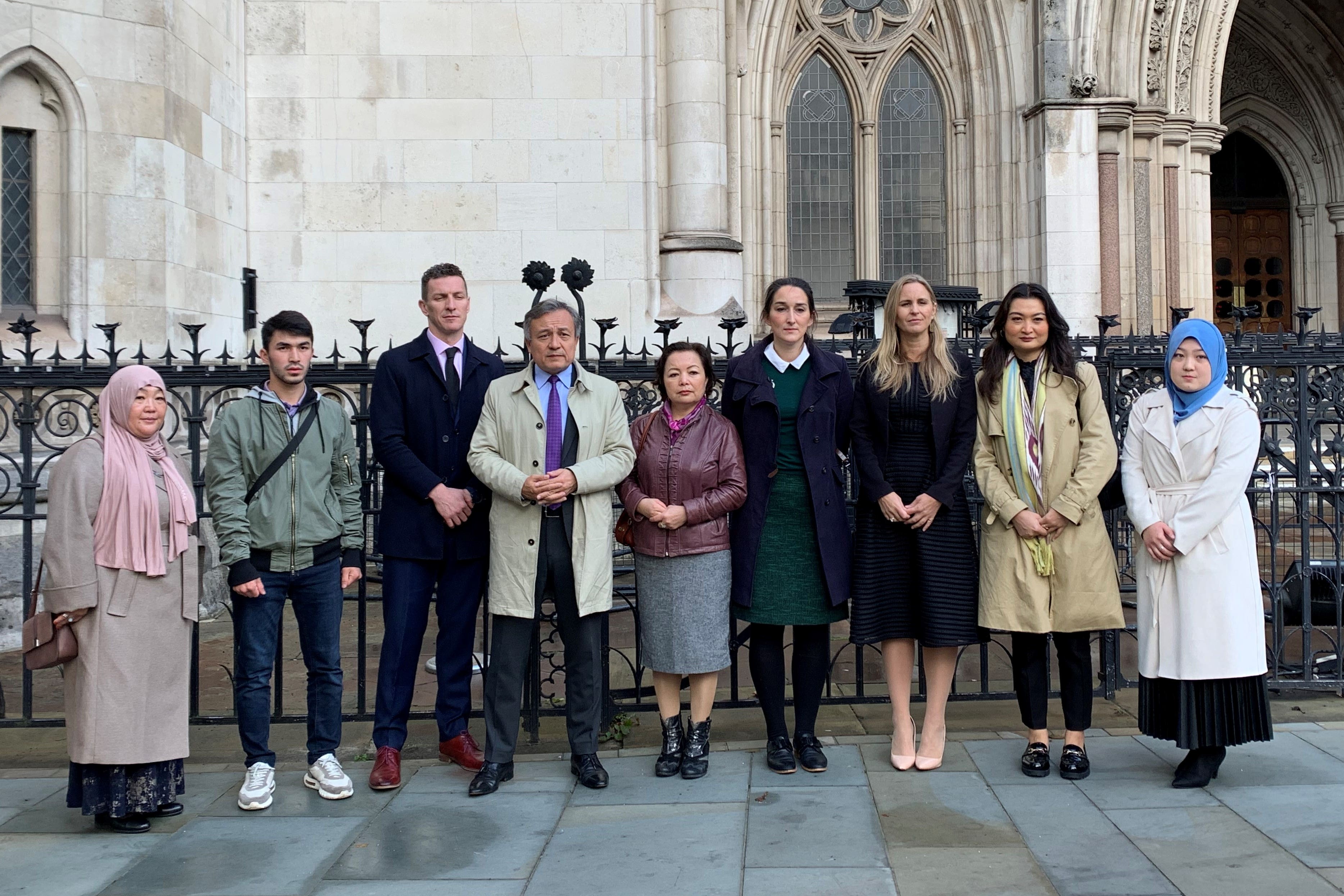 Lawyers and representatives from the World Uyghur Congress and members of the Uyghur community in the UK standing outside the High Court in London (Tom Pilgrim/PA)