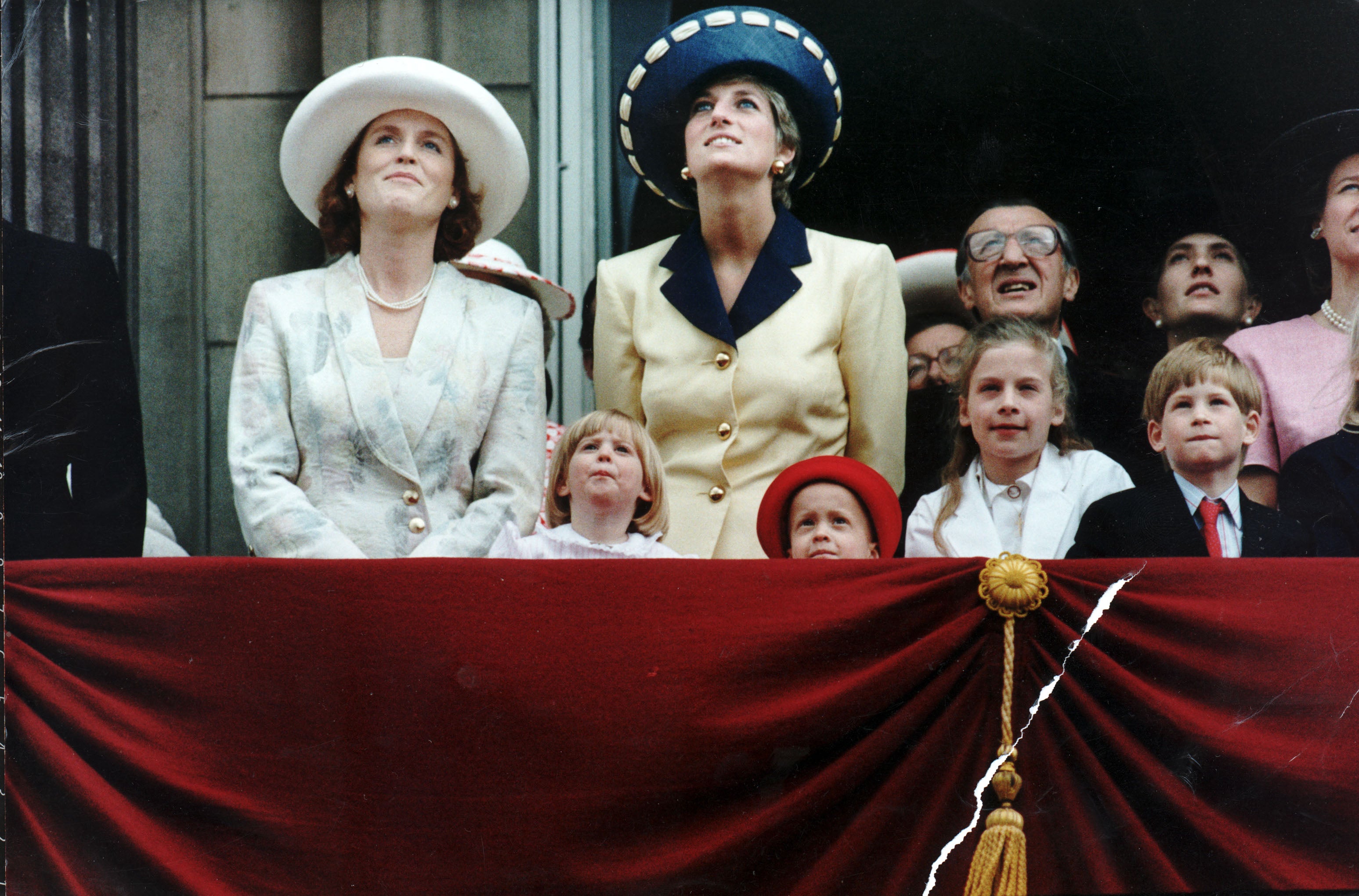 The royal family on the balcony of Buckingham Palace for Trooping The Colour. The Duchess Of York and Diana Princess Of Wales had a grandstand view from the balcony as three Shackleton aircraft led The Queen's 65th Birthday flypast. The children, from left to right: Princess Beatrice, Leonora Knatchbull, Lady Rose Windsor, and Prince Harry.