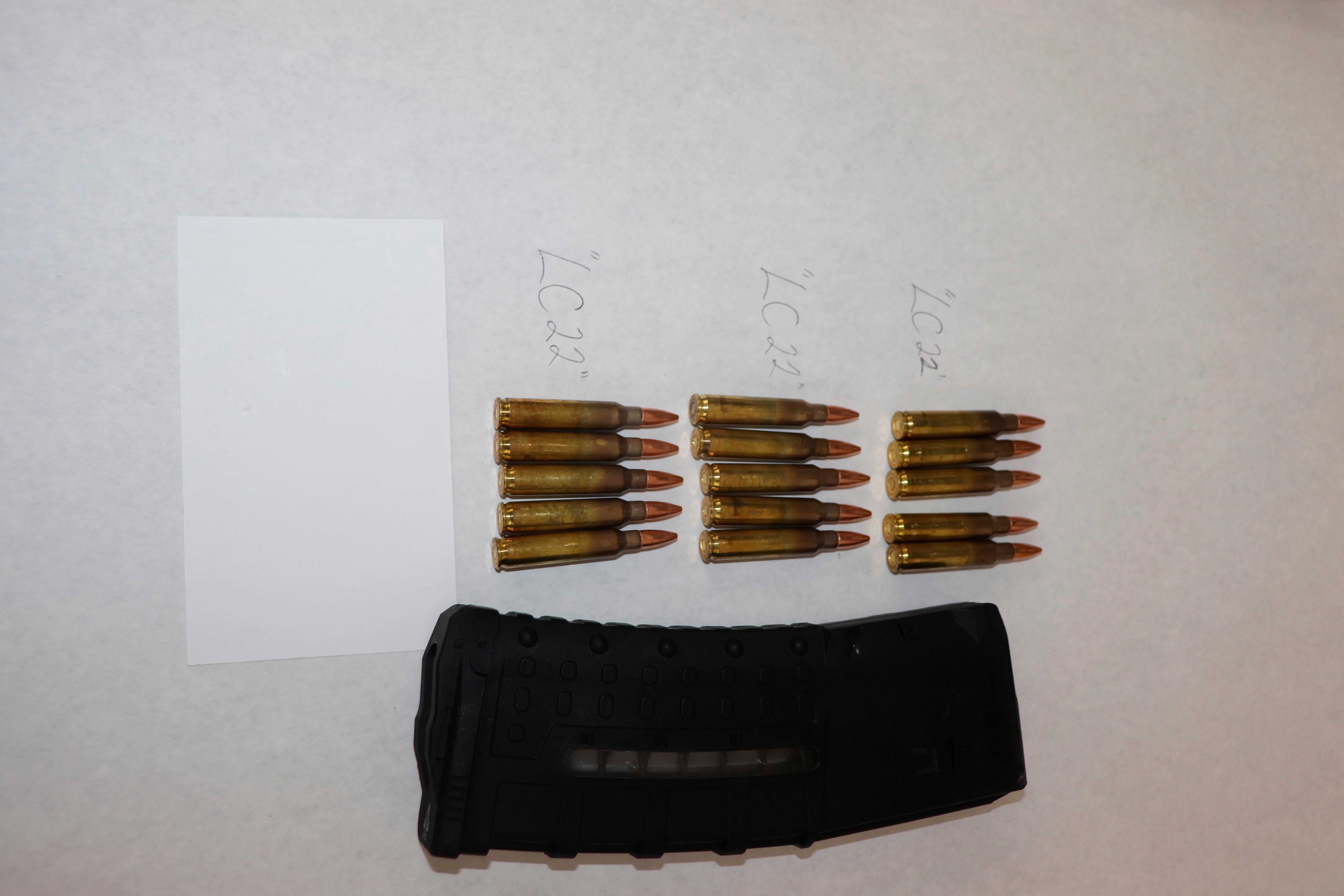 This image provided by the St. Louis Metropolitan Police Department shows ammunition and magazine used by a 19-year-old gunman who killed a teacher and a 15-year-old girl at a St. Louis high school on Monday, Oct. 24, 2022