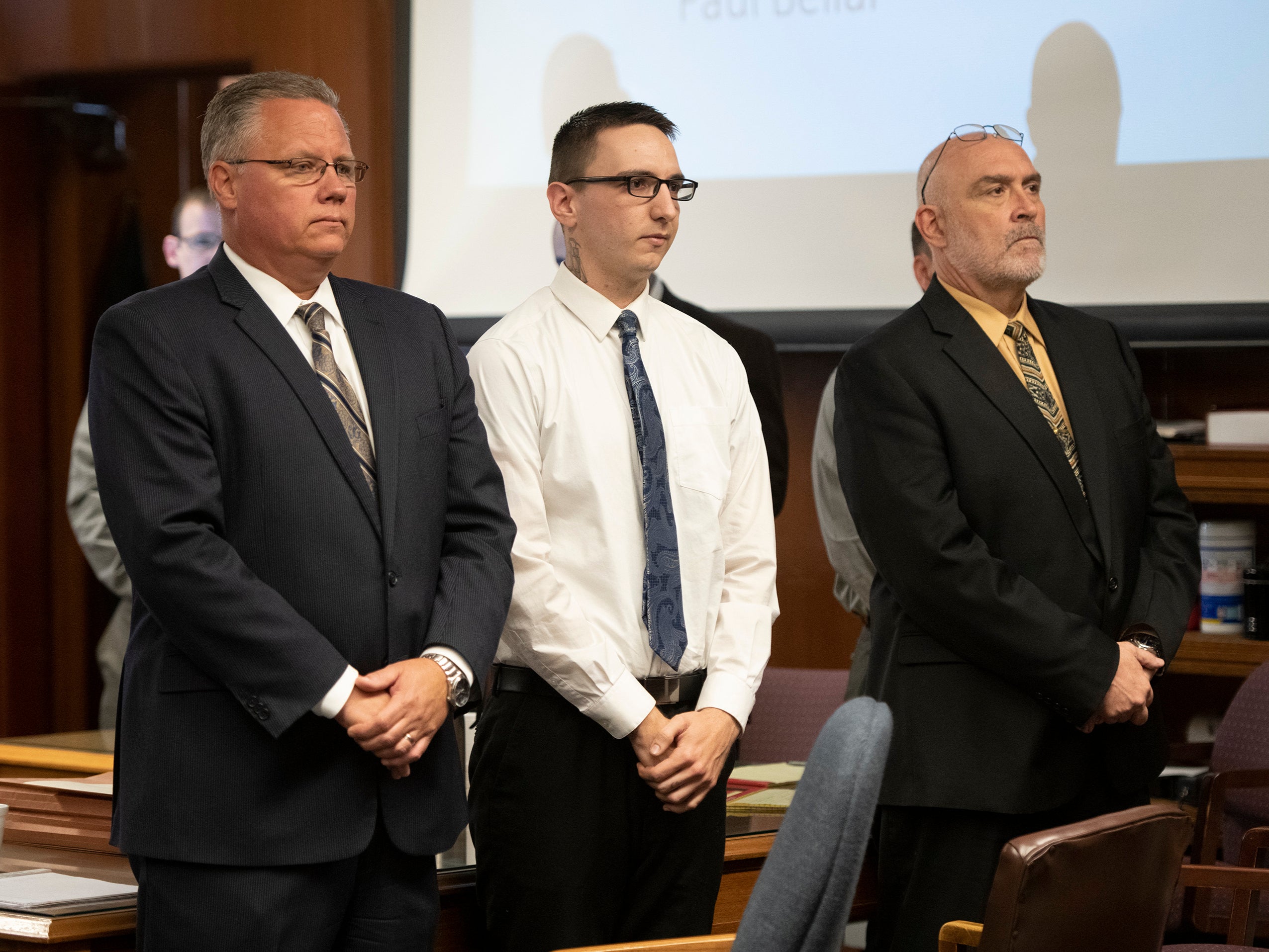 Paul Bellar, middle, appears before Jackson County Circuit Court Judge Thomas Wilson on Wednesday, Oct. 5, 2022 for trial in Jackson, Mich. Paul Bellar, Joseph Morrison and Pete Musico are charged in connection with a 2020 anti-government plot to kidnap Michigan Gov. Gretchen Whitmer. (J. Scott Park/Jackson Citizen Patriot via AP, Pool)