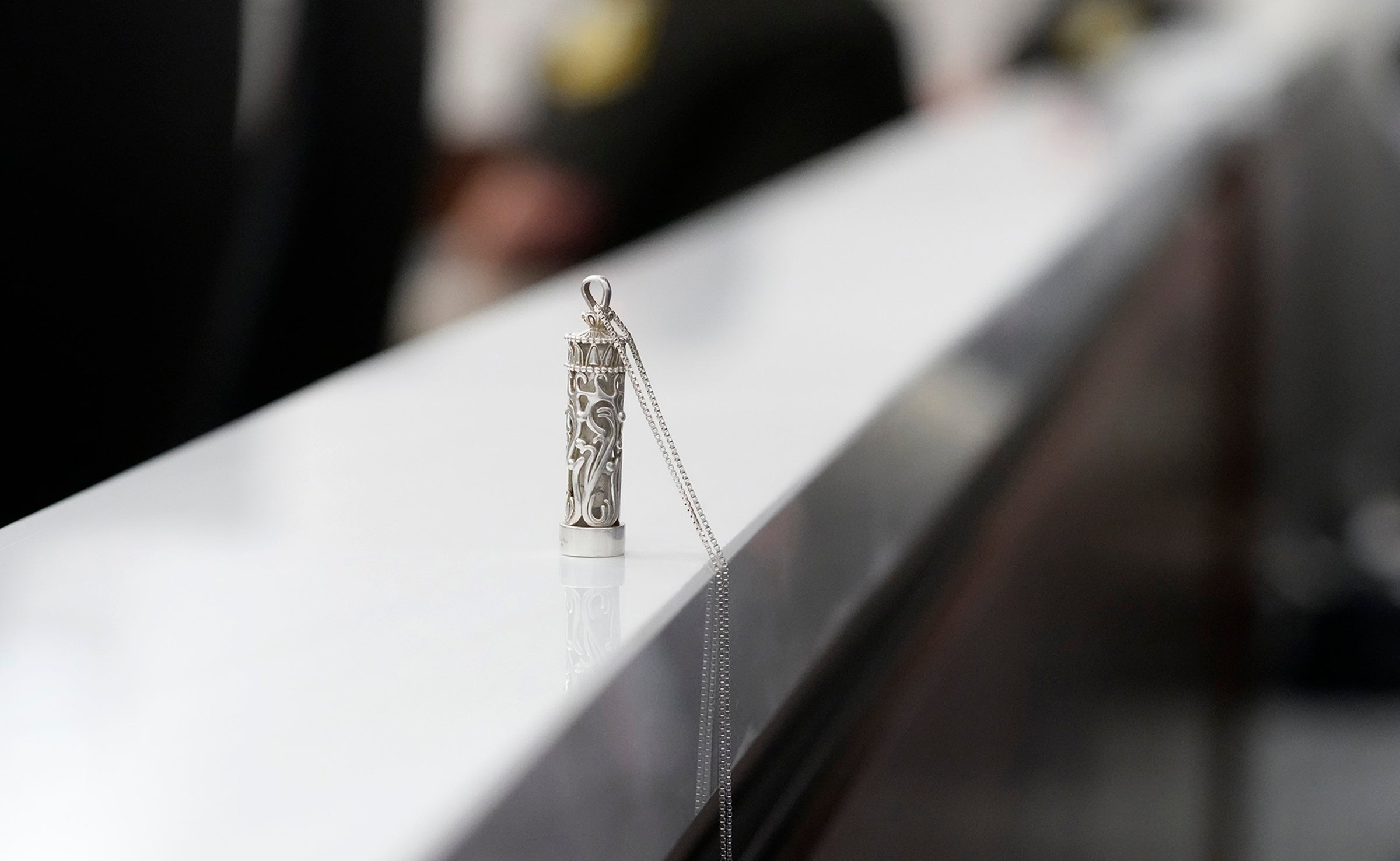 A container holding the ashes of victim Virginia "Ginny" E. Sorenson sits on the ledge between the gallery and the courtroom as the verdict is read