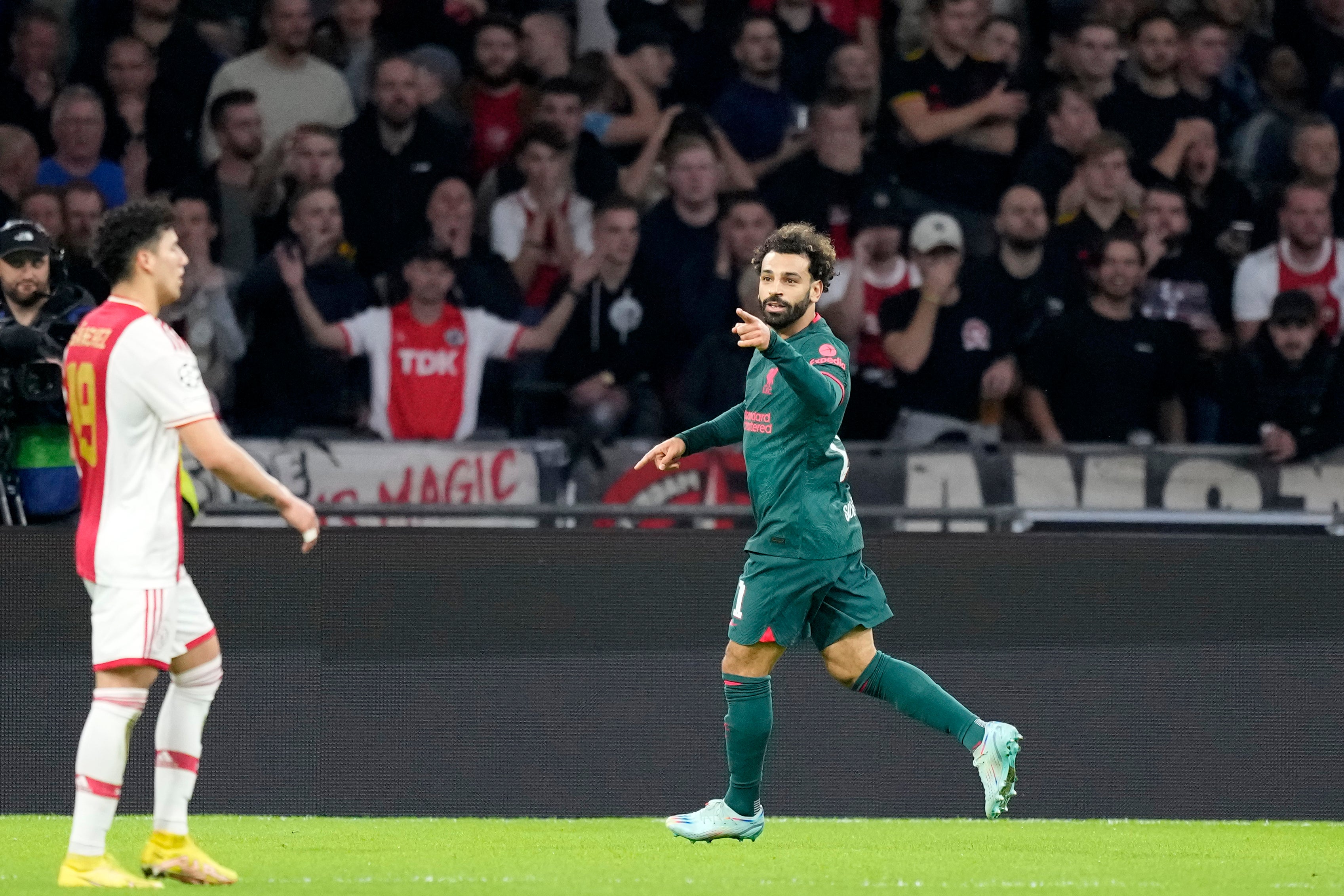 Mohamed Salah celebrates after scoring the opening goal