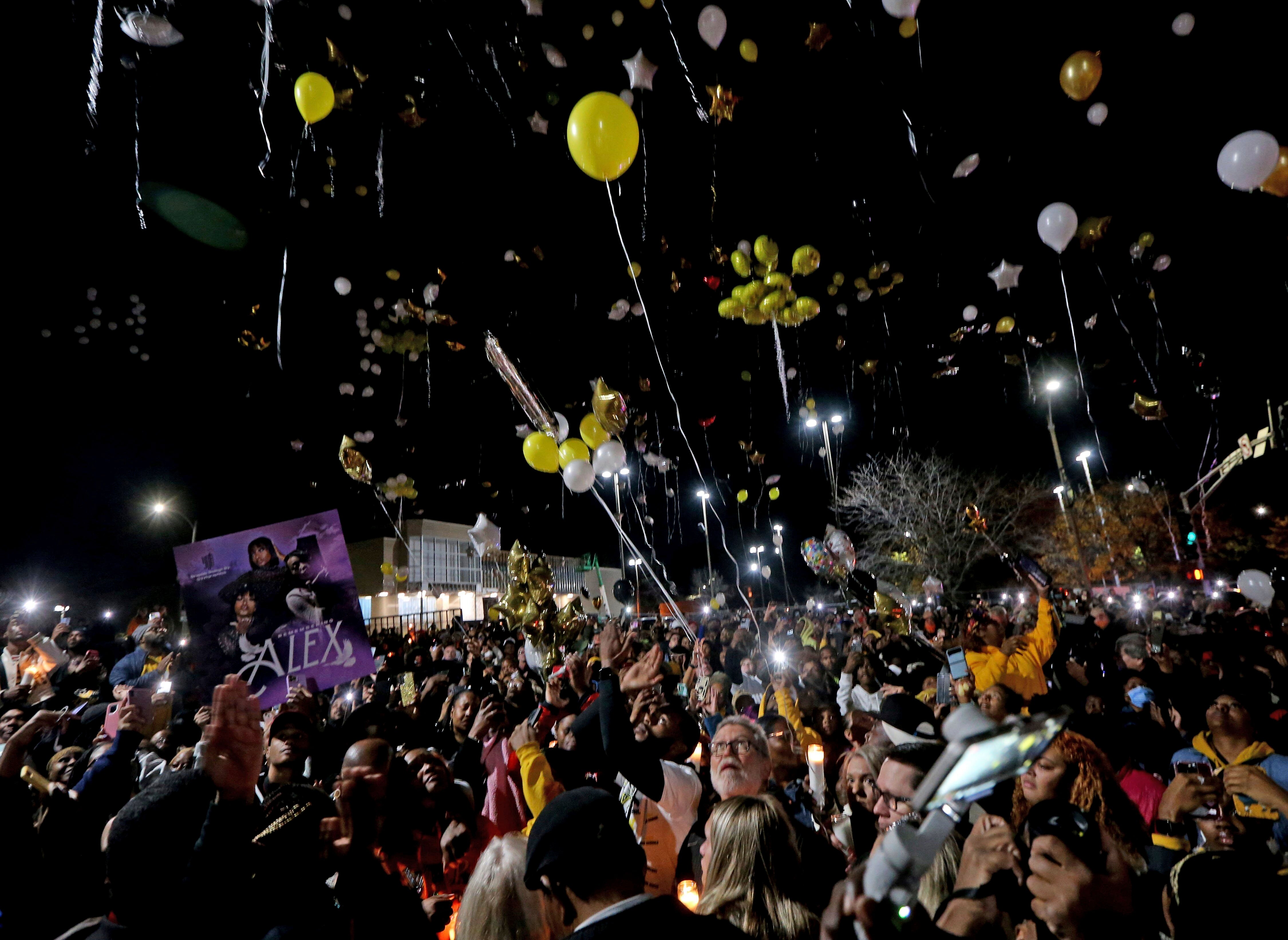 Hundreds of attendees release balloons during a vigil outside Central Visual & Performing Arts and Collegiate School of Medicine & Bioscience High Schools on Wednesday, October 26, 2022