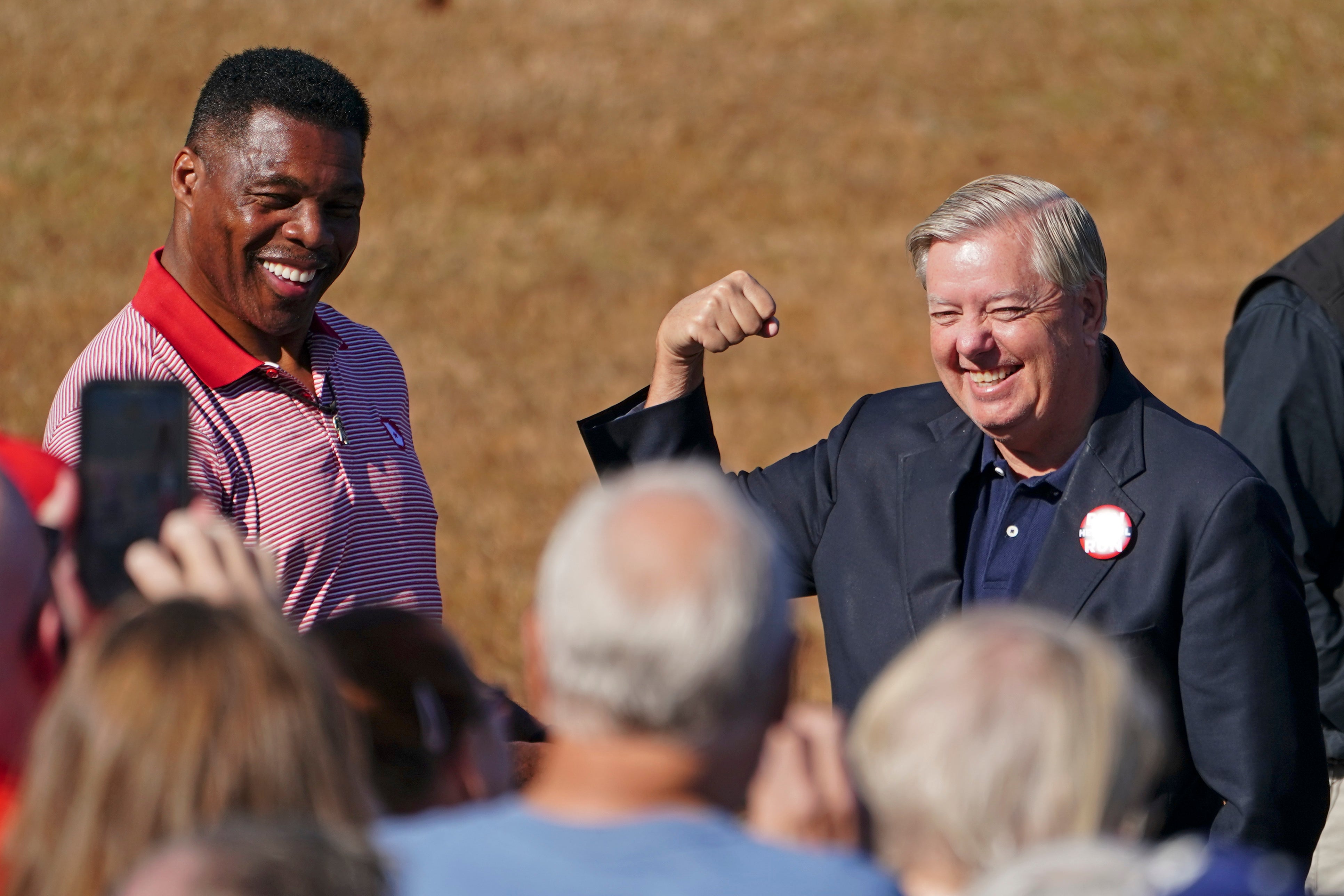 Lindsey Graham, right, campaigning with Herschel Walker