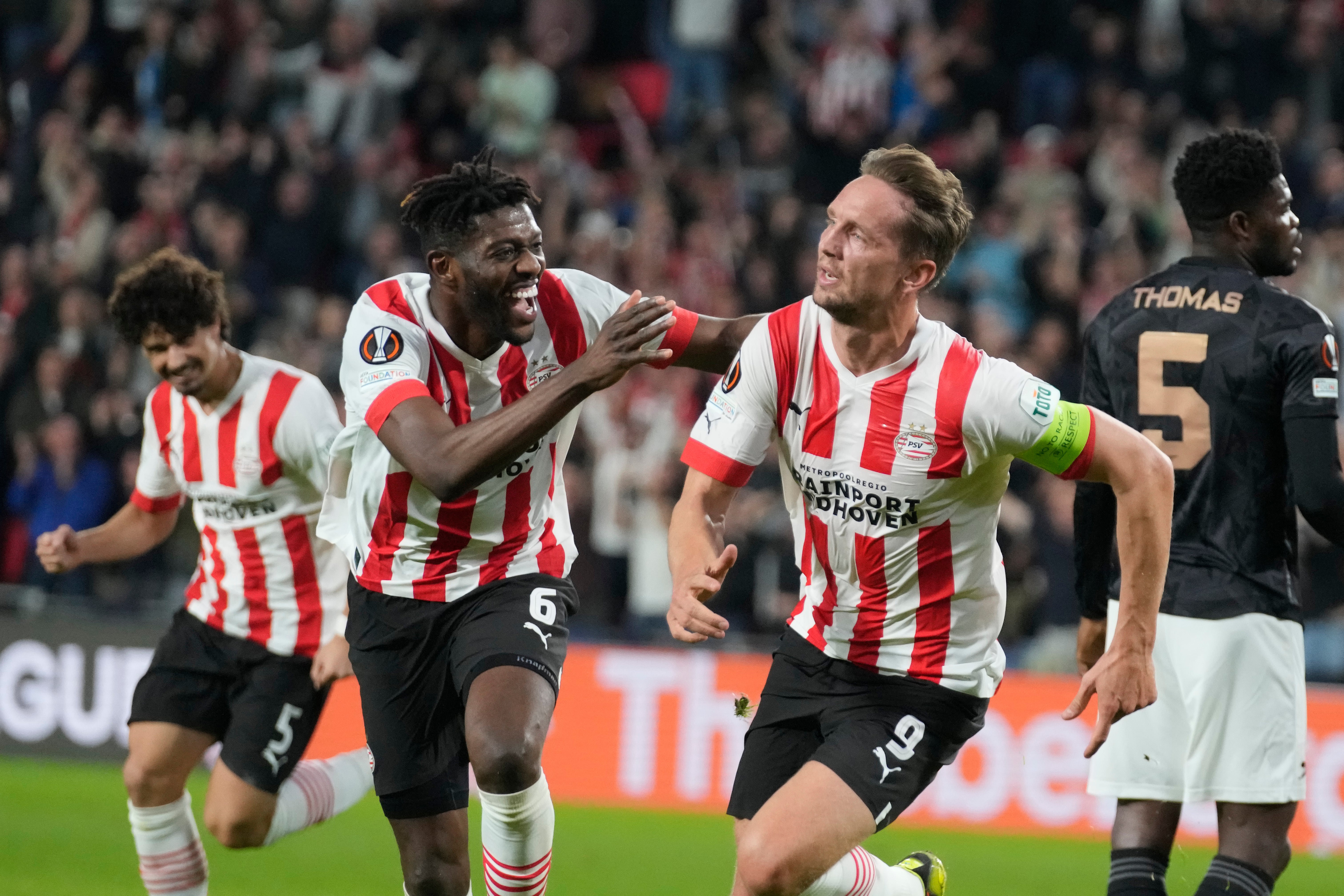 PSV's Luuk de Jong, right, celebrates with Ibrahim Sangare after scoring