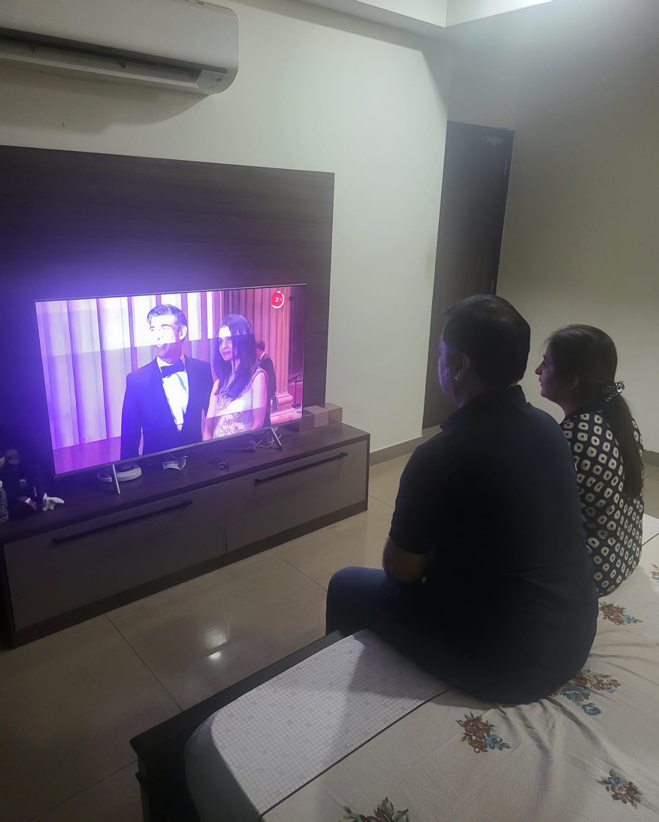 Rishi Sunak’s cousin Ajay Berry and his wife watch news coverage of the new prime minister in Ludhiana, India