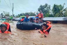 At least 31 people killed as heavy rains from tropical storm Nalgae hit the Philippines