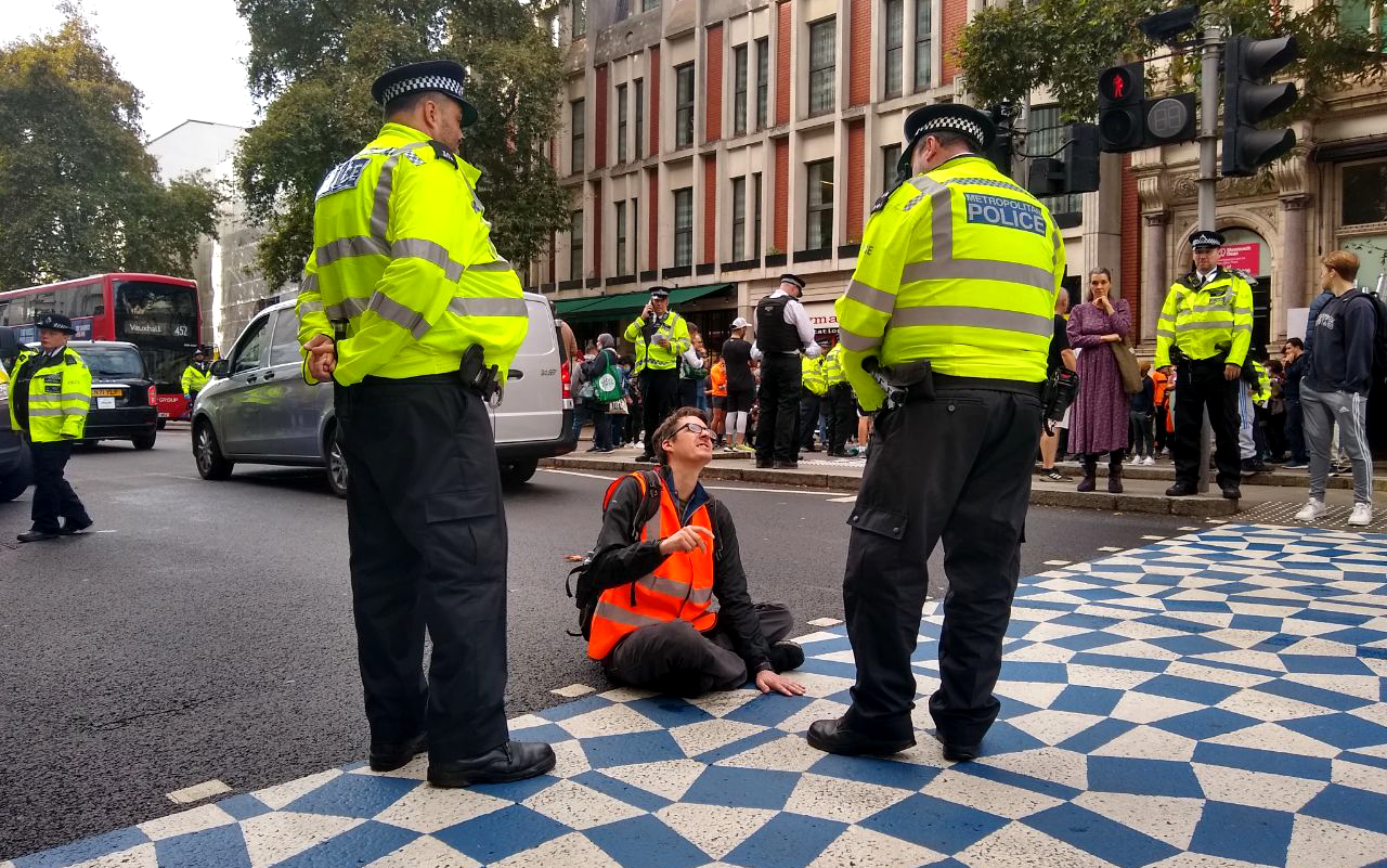 Police have taken to task unglueing protesters’ hands from the road