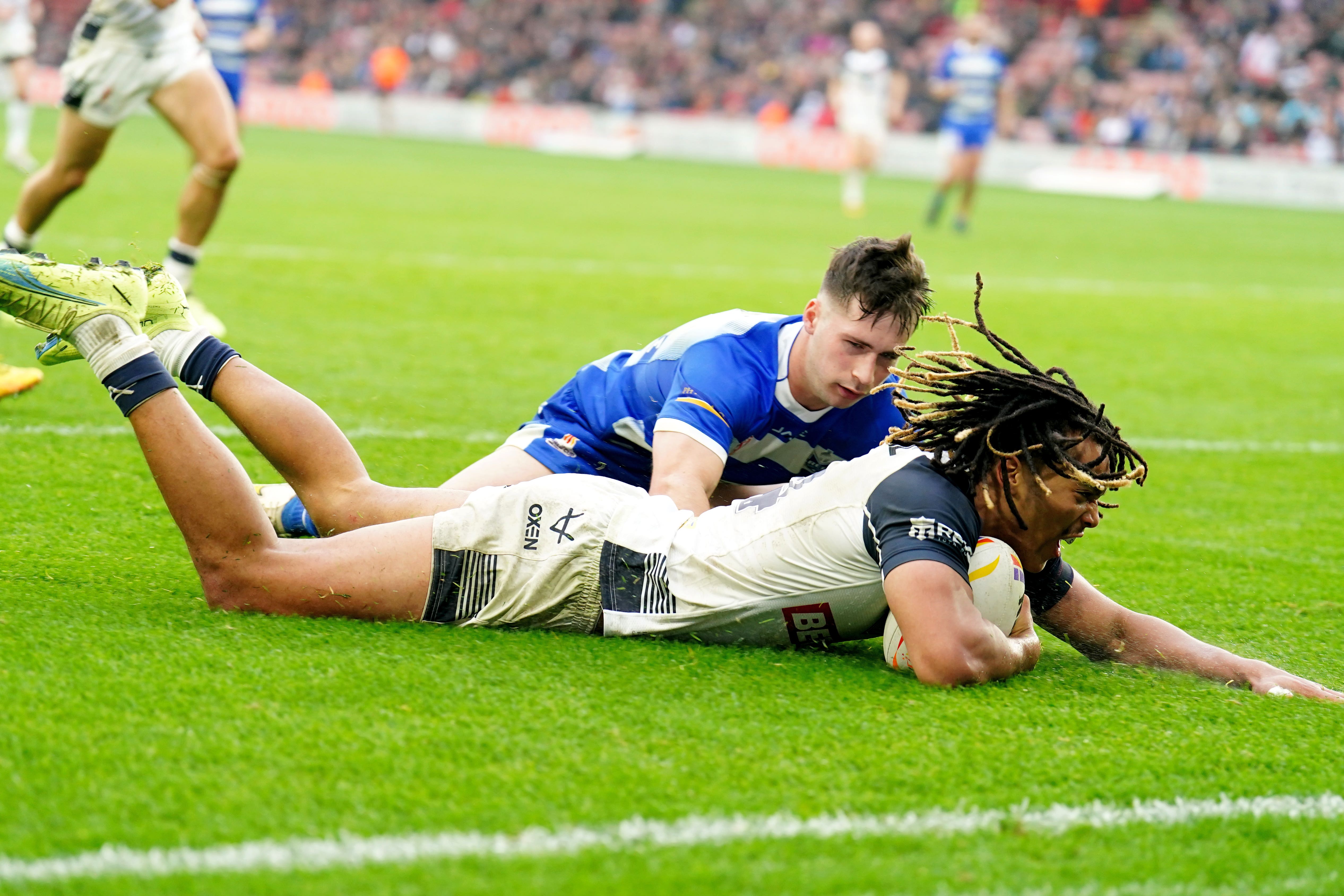 England winger Dominic Young scores one of his four tries in the 94-4 win over Greece (Mike Egerton/PA Images).