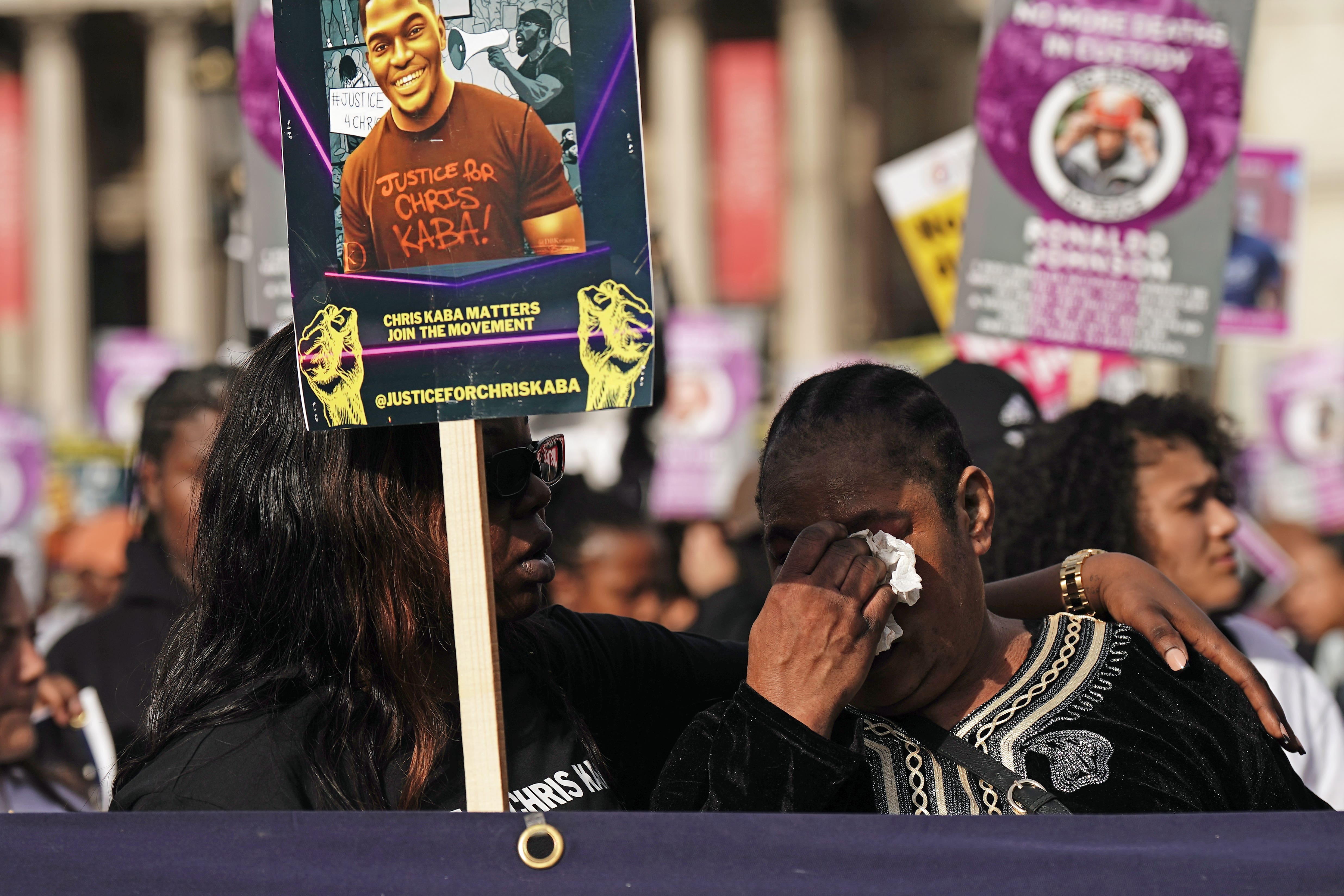 A woman is upset as members of the United Families and Friends Campaigns (UFFC) take part in their 24th Annual Remembrance Procession in London (Aaron Chown/PA)