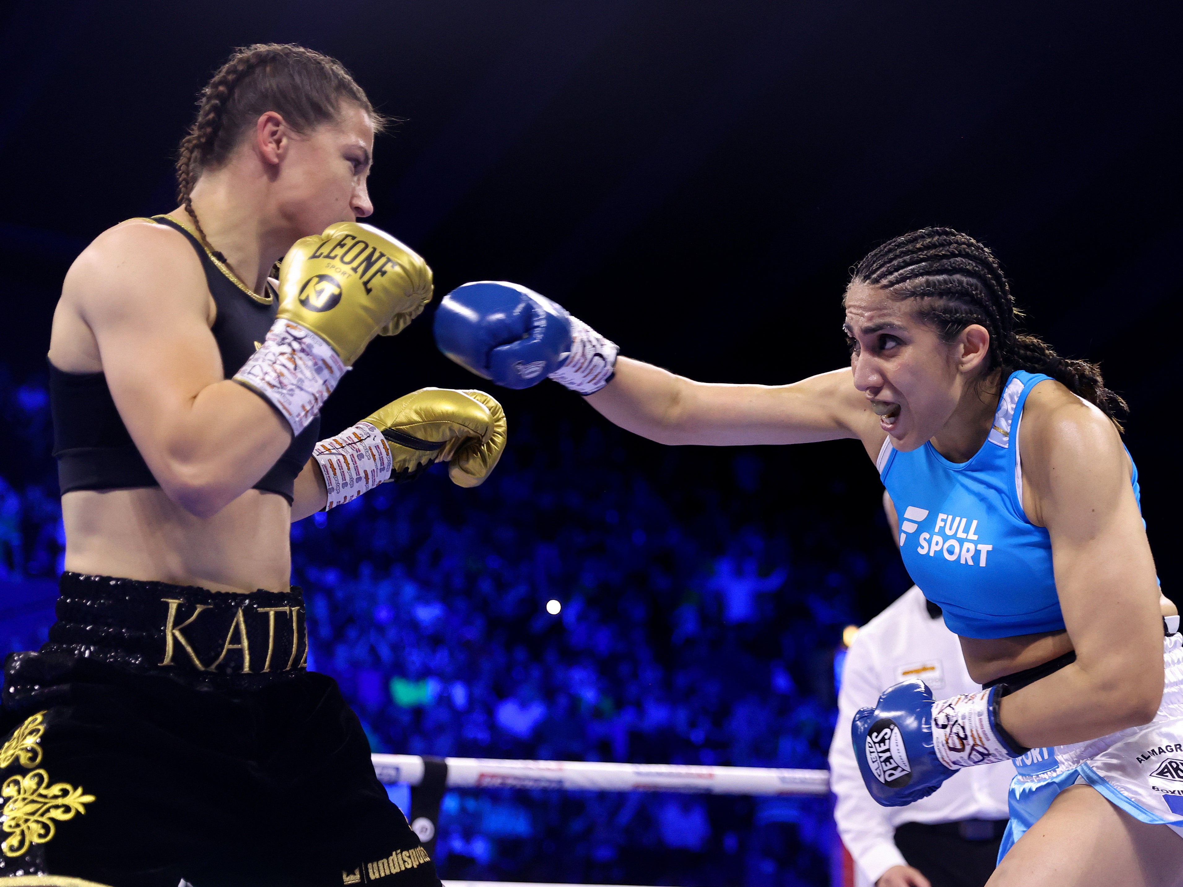 Katie Taylor (left) defending her titles against Karen Elizabeth Carabajal