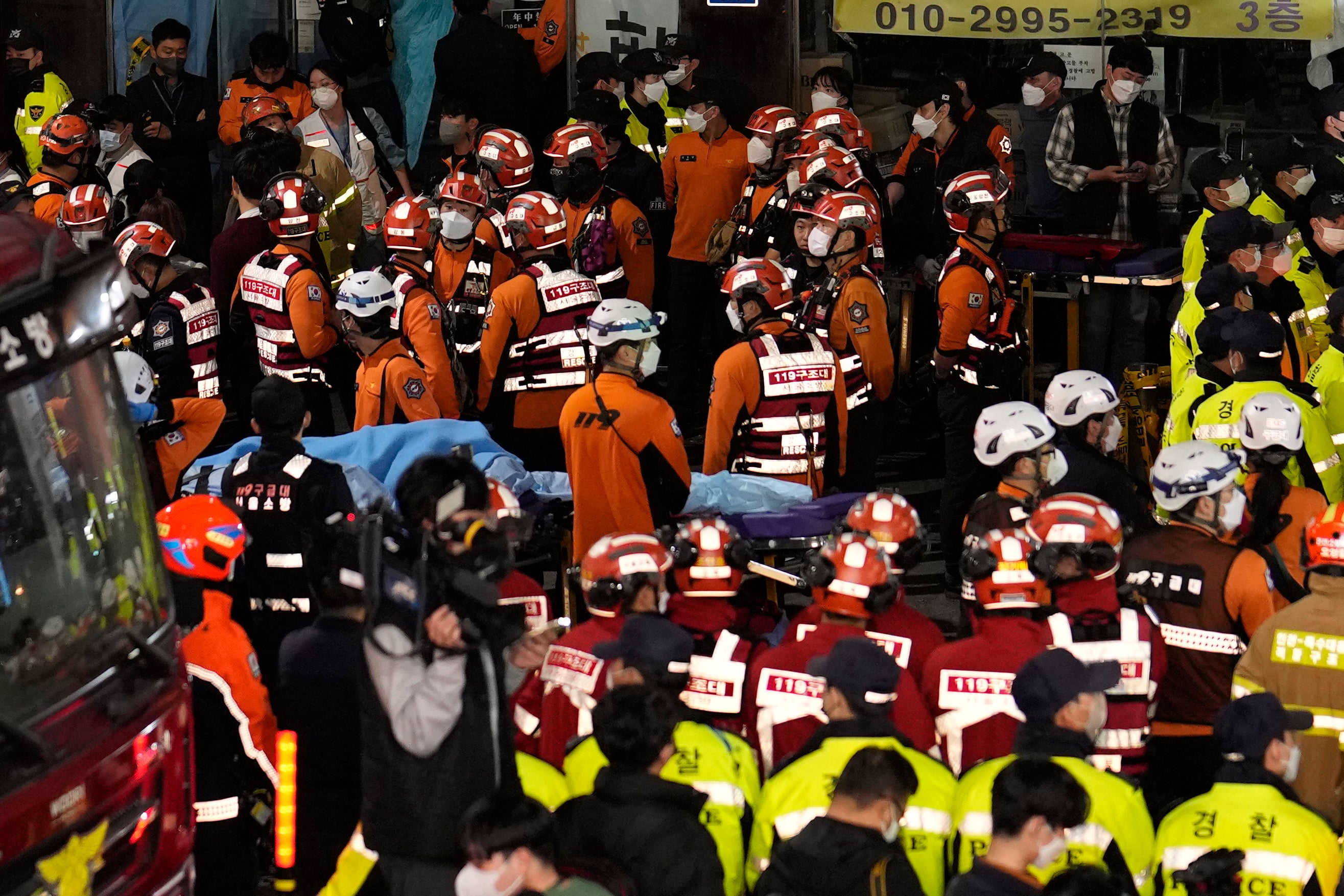 Rescue workers try to help the wounded on Saturday night