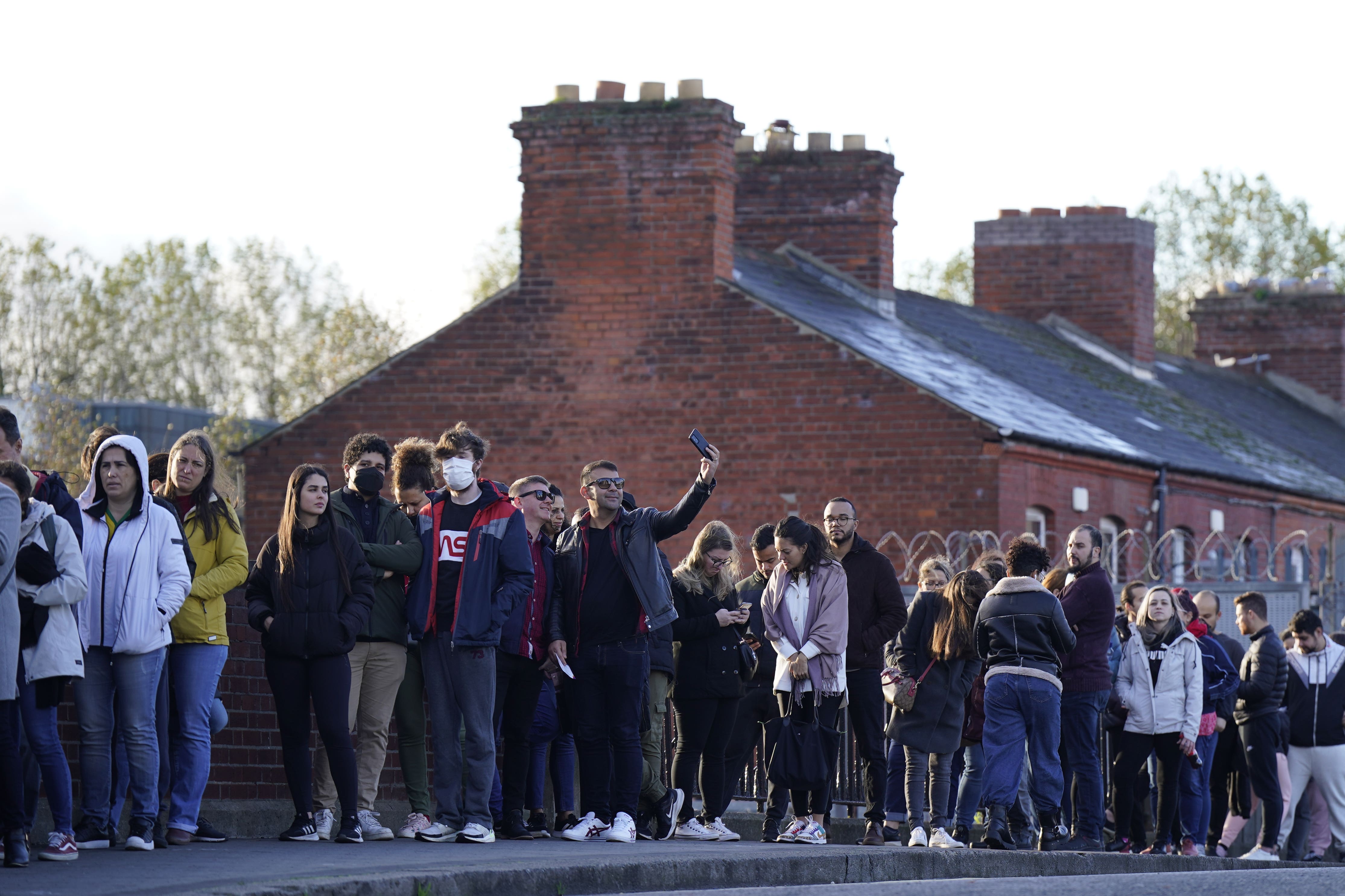 Brazilians from all over Ireland queue at Croke Park in Dublin to vote in their country’s presidential election (Niall Carson/PA)