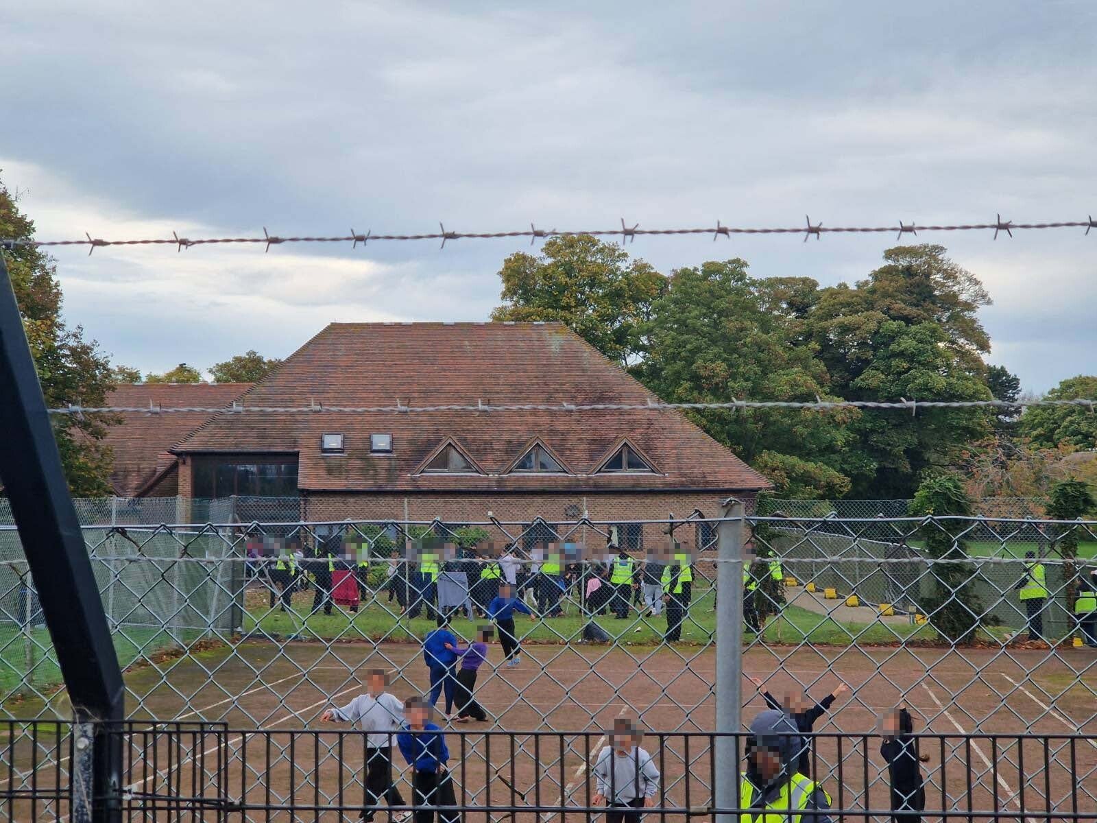 Young children were filmed shouting ‘Freedom’ from inside the centre