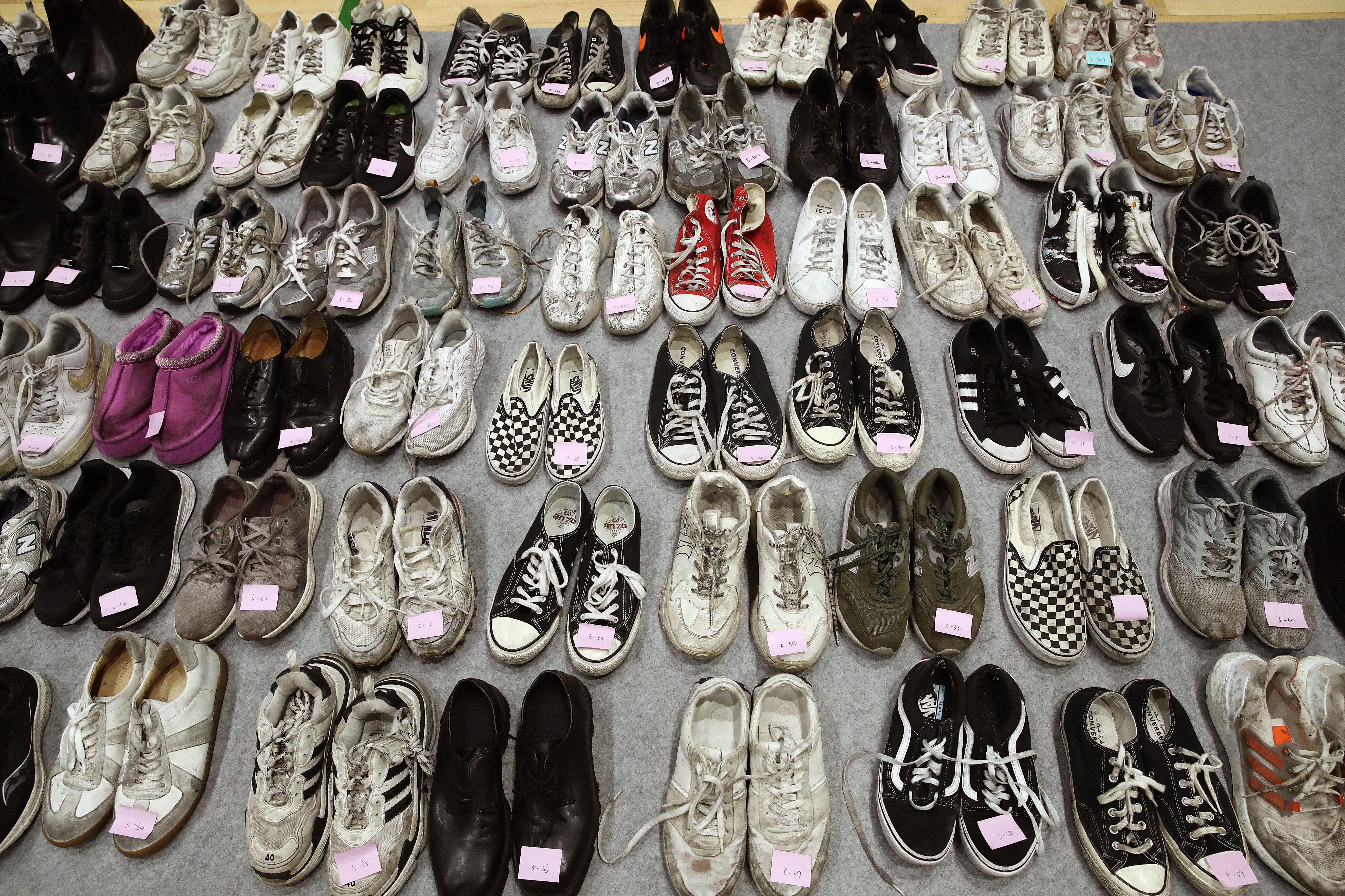 The belongings of victims of the deadly Halloween celebration stampede are shown at a gym on 1 November 2022 in Seoul, South Korea