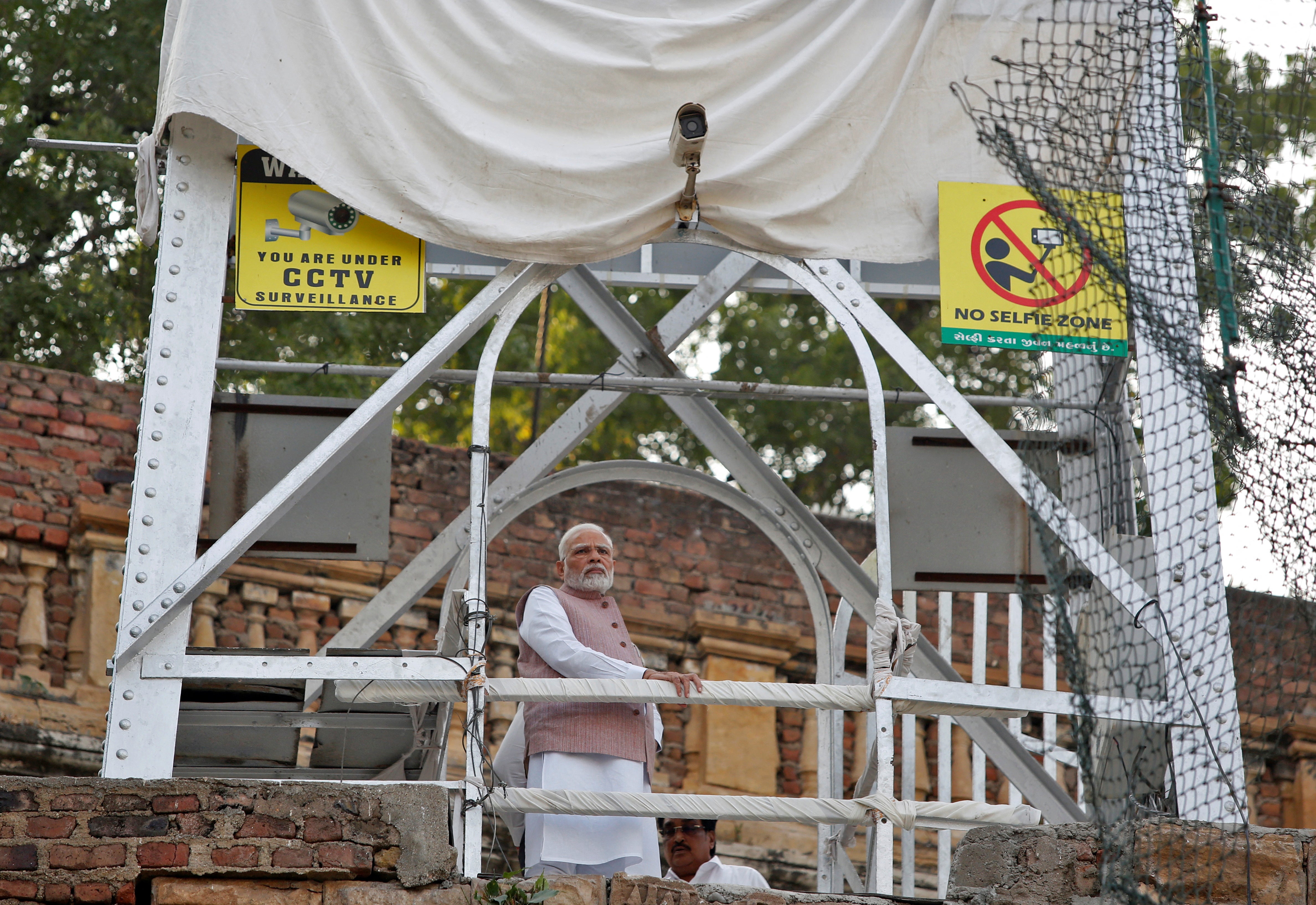 Mr Modi visits the site of a suspension bridge collapse in Morbi town in the western state of Gujarat