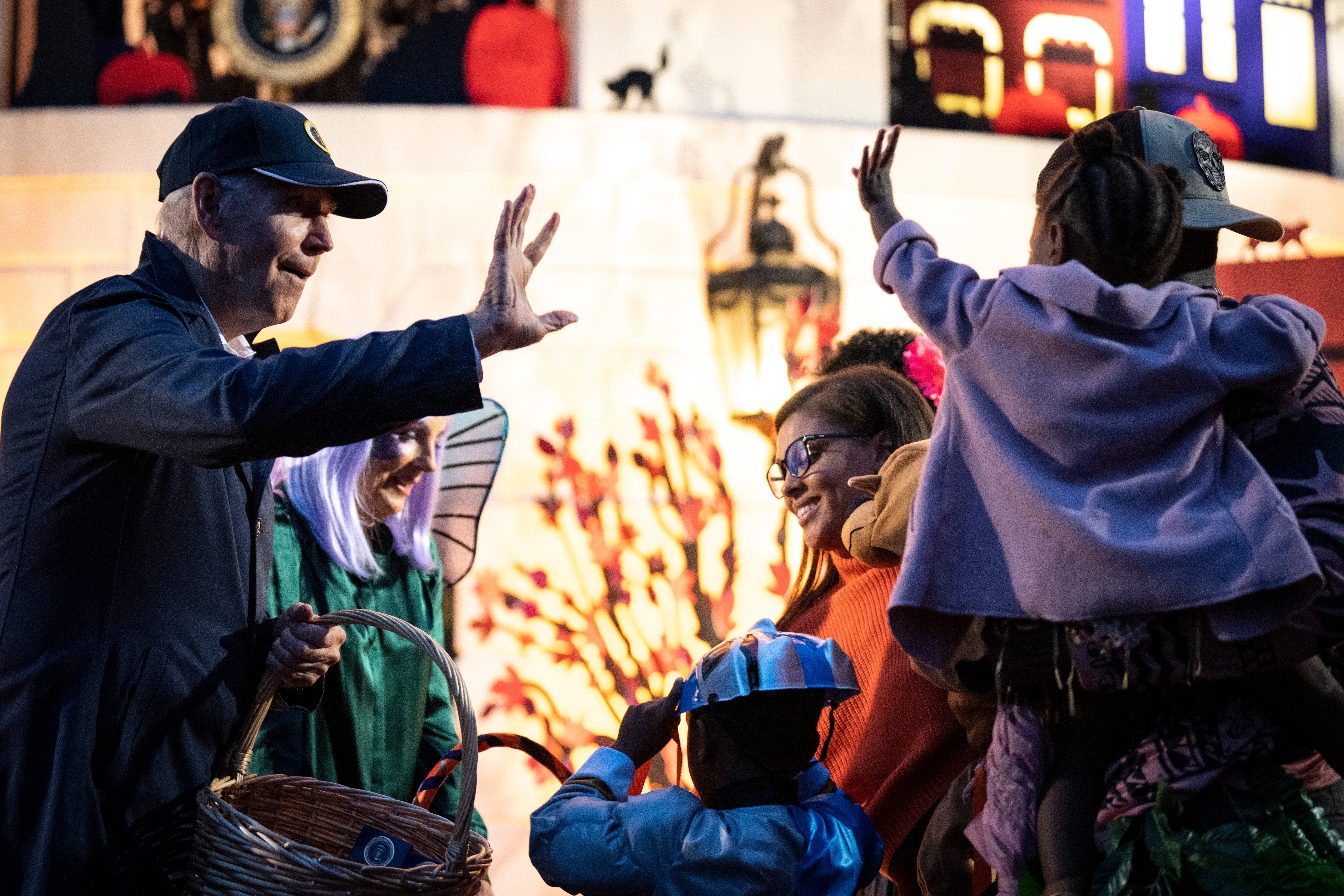 U.S. President Joe Biden and first lady Jill Biden greet trick-or-treaters during a Halloween event on the South Lawn of the White House October 31, 2022 in Washington, DC