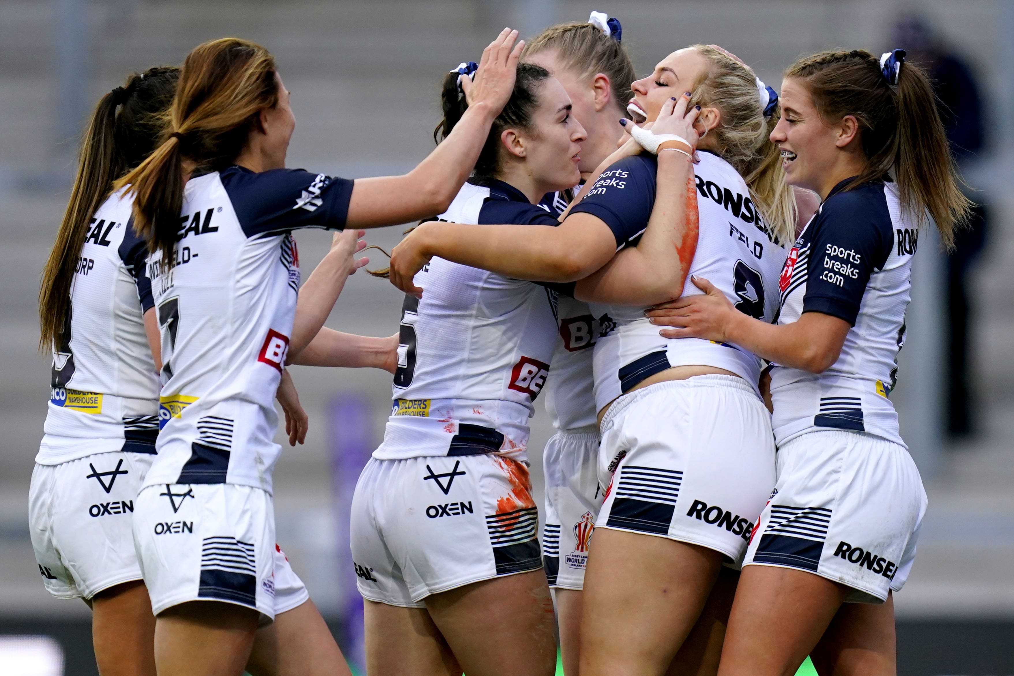 England players celebrate after scoring a try in their opening World Cup game against Brazil (Danny Lawson/PA)