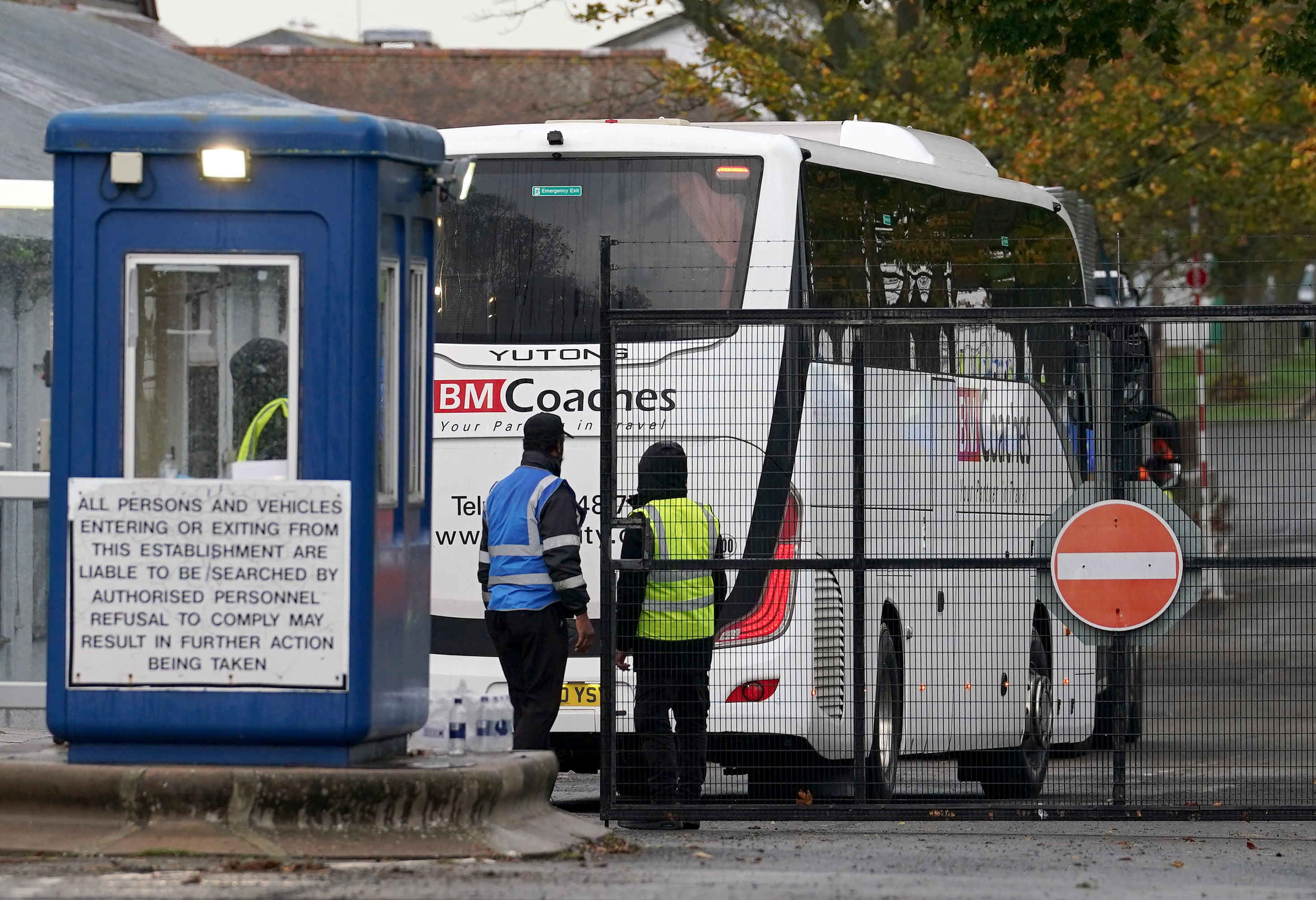 A coach arrives at the Manston immigration short-term holding facility on Tuesday to transfer asylum seekers to hotels