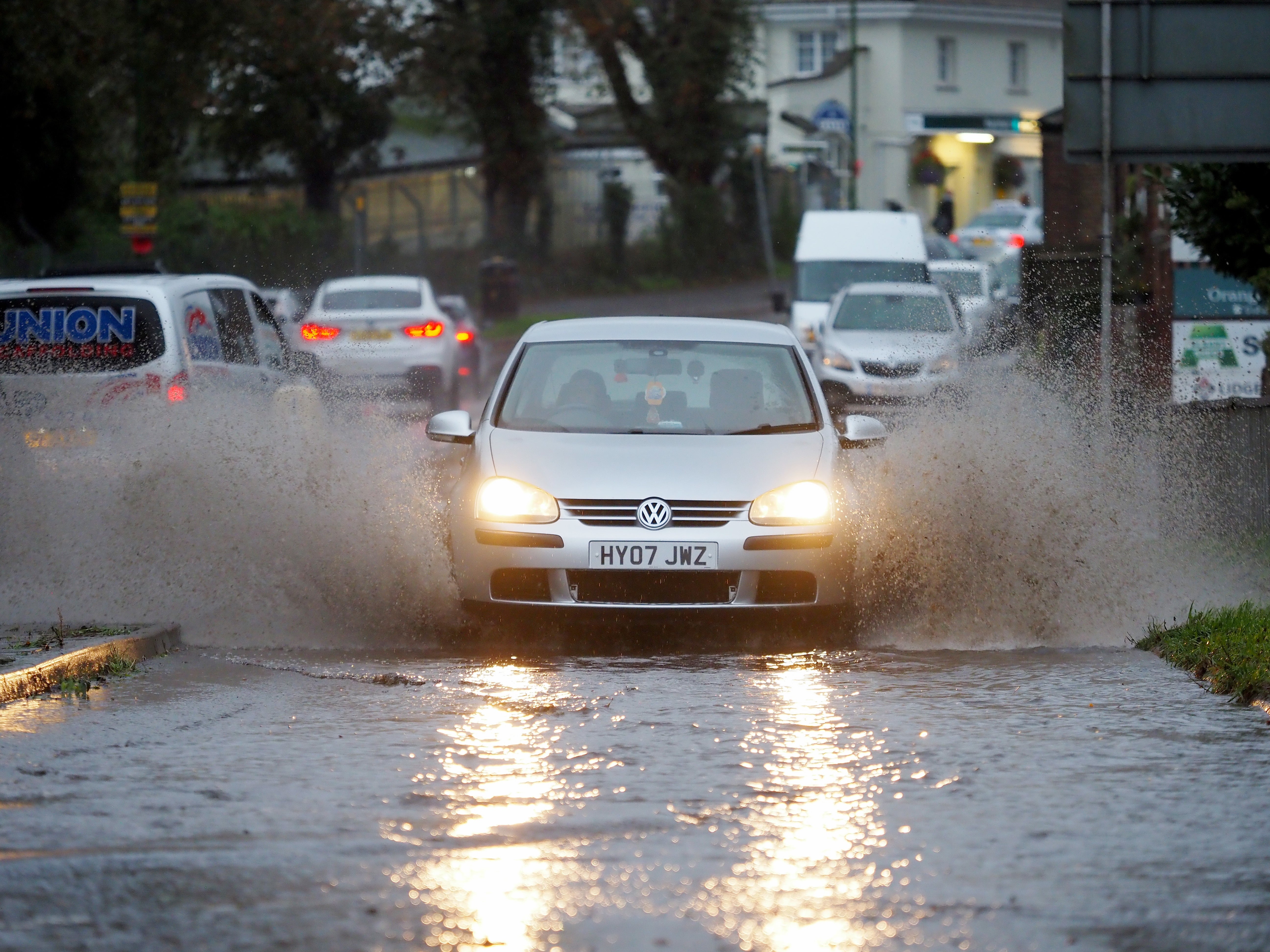 Drivers navigate flooded roads in London