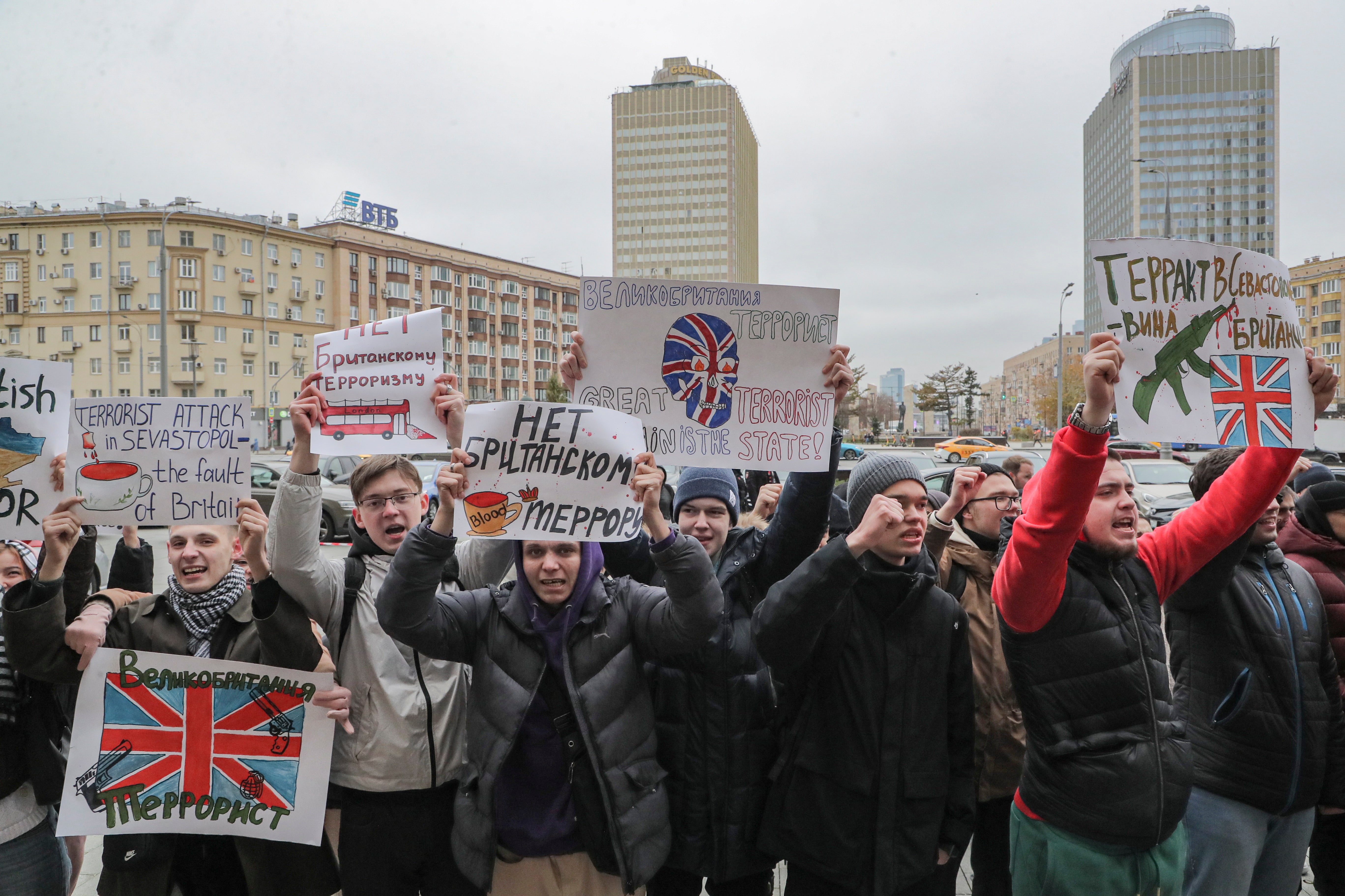 Protesters with placards reading ‘No British terror. Great Britain is terrorist. Terror attack in Sevastopol is Britain’s fault’ outside the Russian foreign ministry