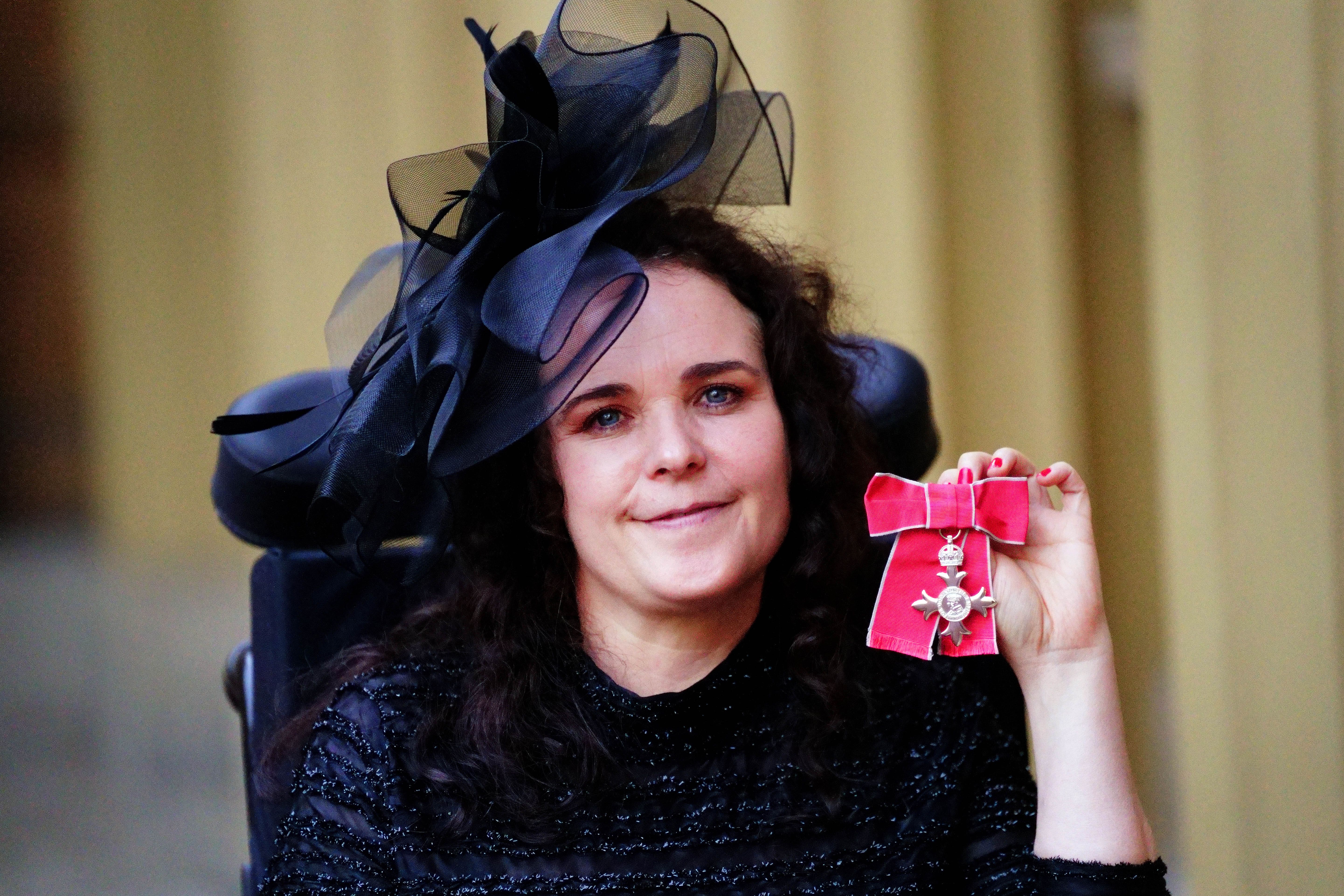 Actress Cherylee Houston after being made a Member of the Order of the British Empire by the Princess Royal at Buckingham Palace, for services to drama and to people with disabilities (Victoria Jones/PA)