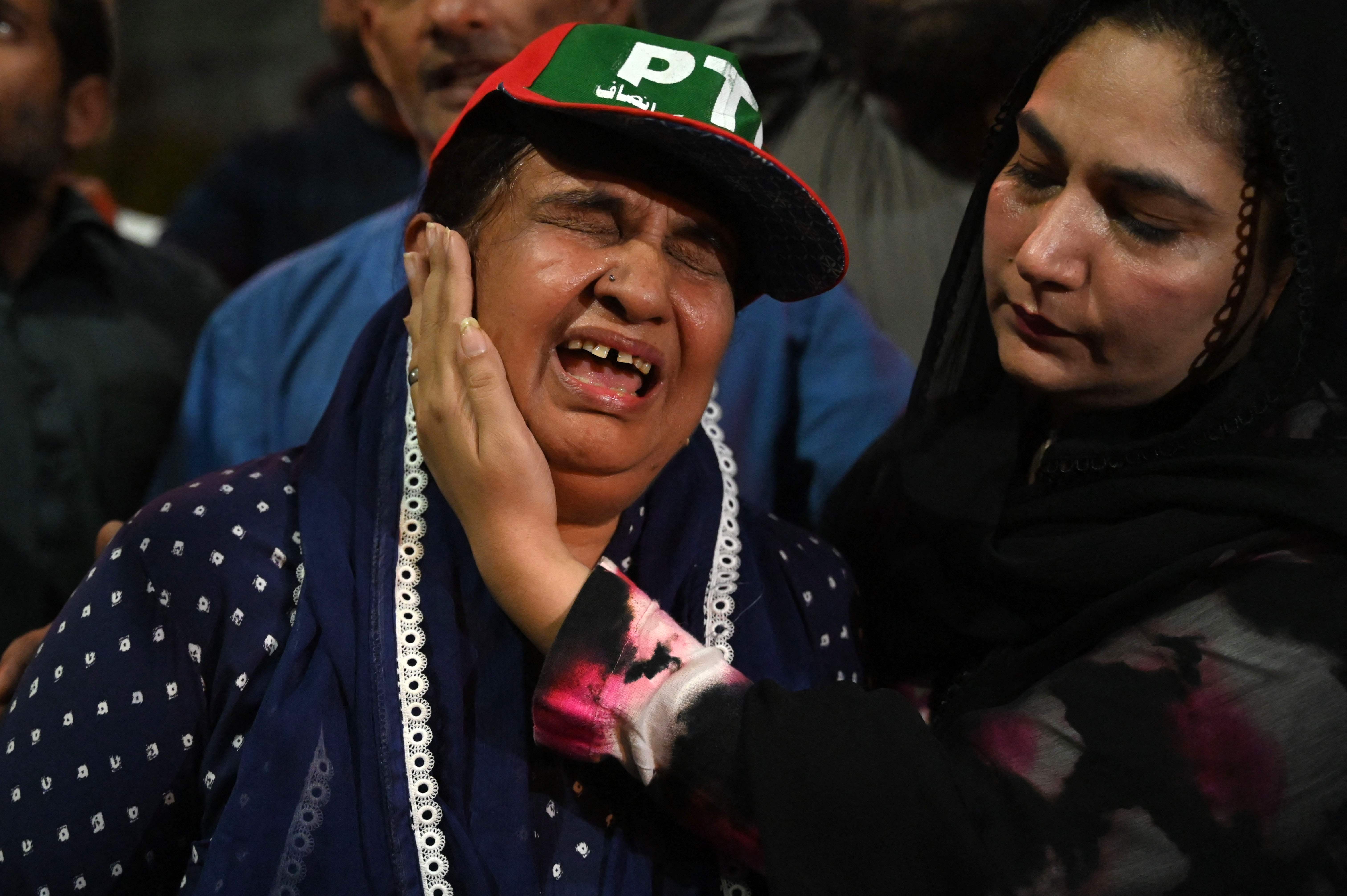 Supporters of Pakistan’s former prime minister Imran Khan react during a protest against the assassination attempt on Khan