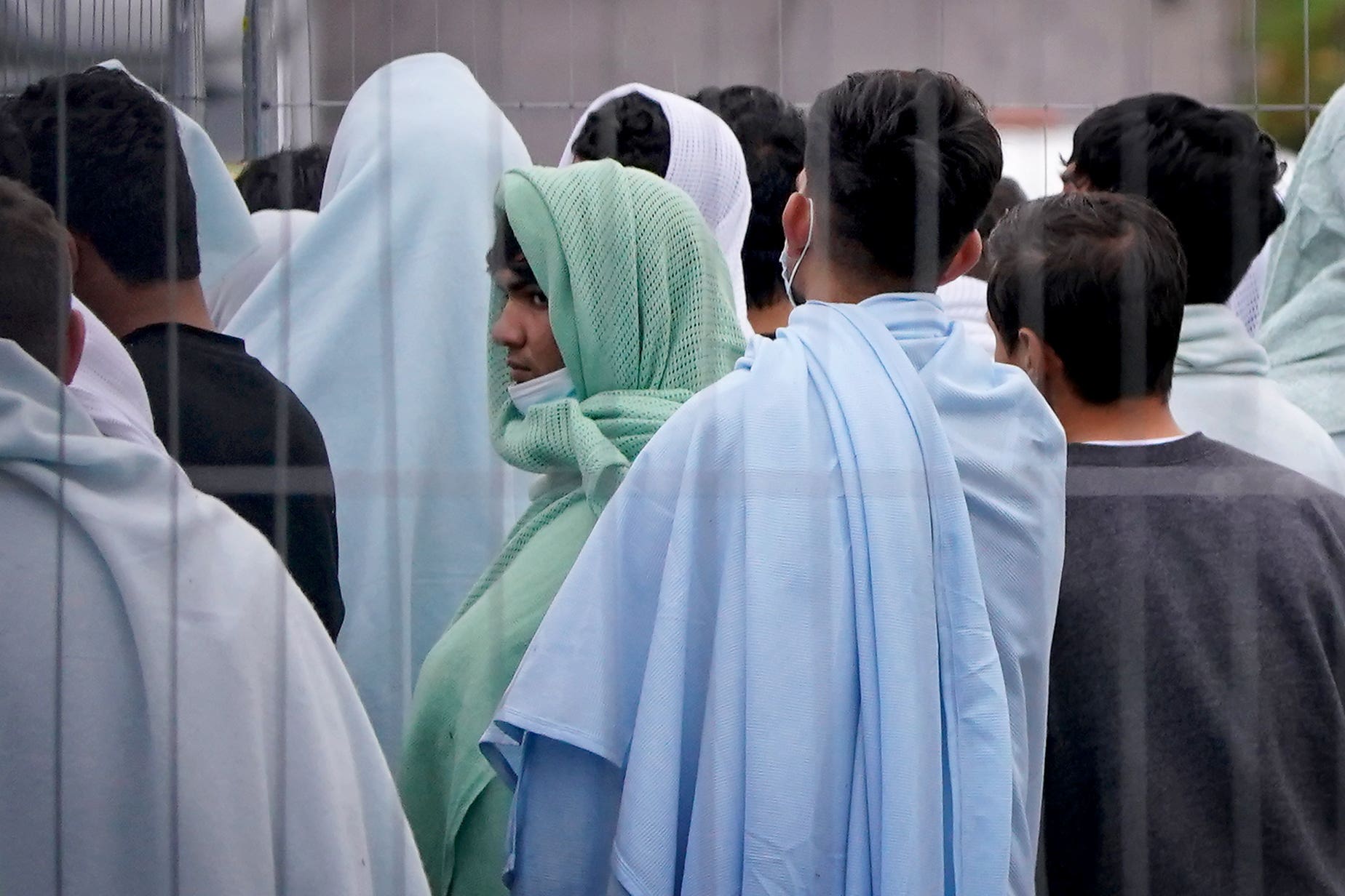 A view of people thought to be migrants inside the Manston immigration short-term holding facility (PA)