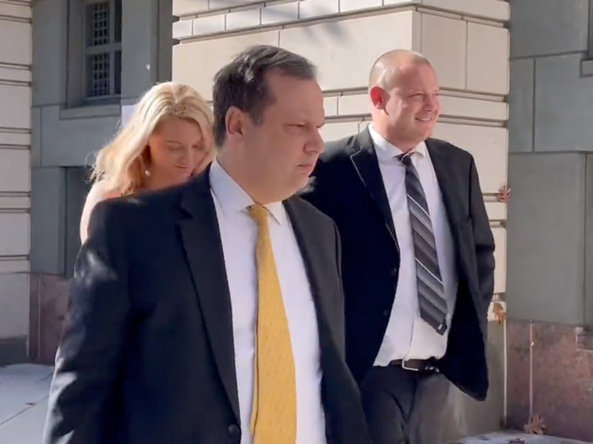 Troy Faulkner walks outside a DC courthouse after being sentenced to five months in prison