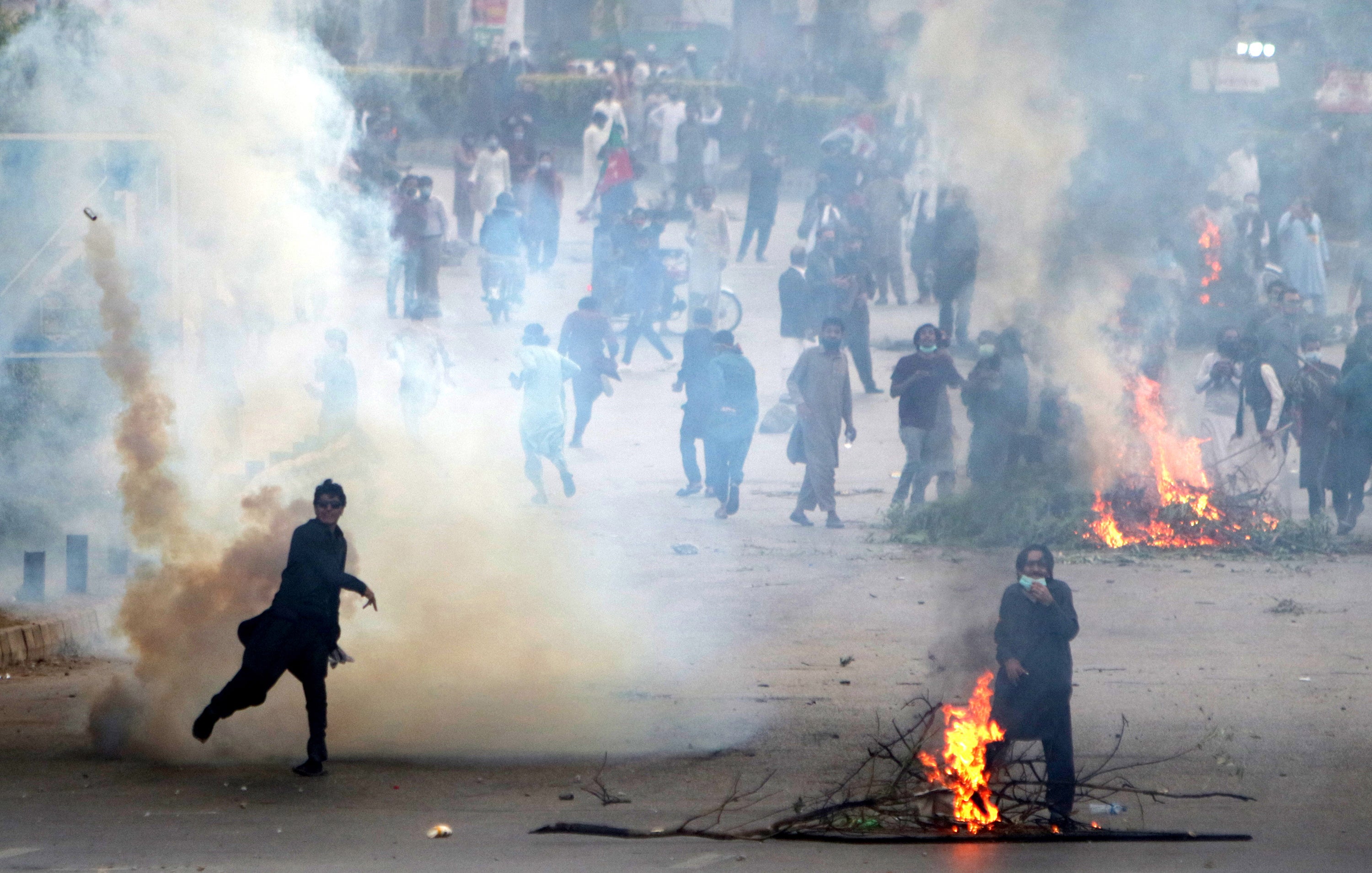 Pakistan Tehreek-e-Insaf (PTI) supporters clash with police on Friday